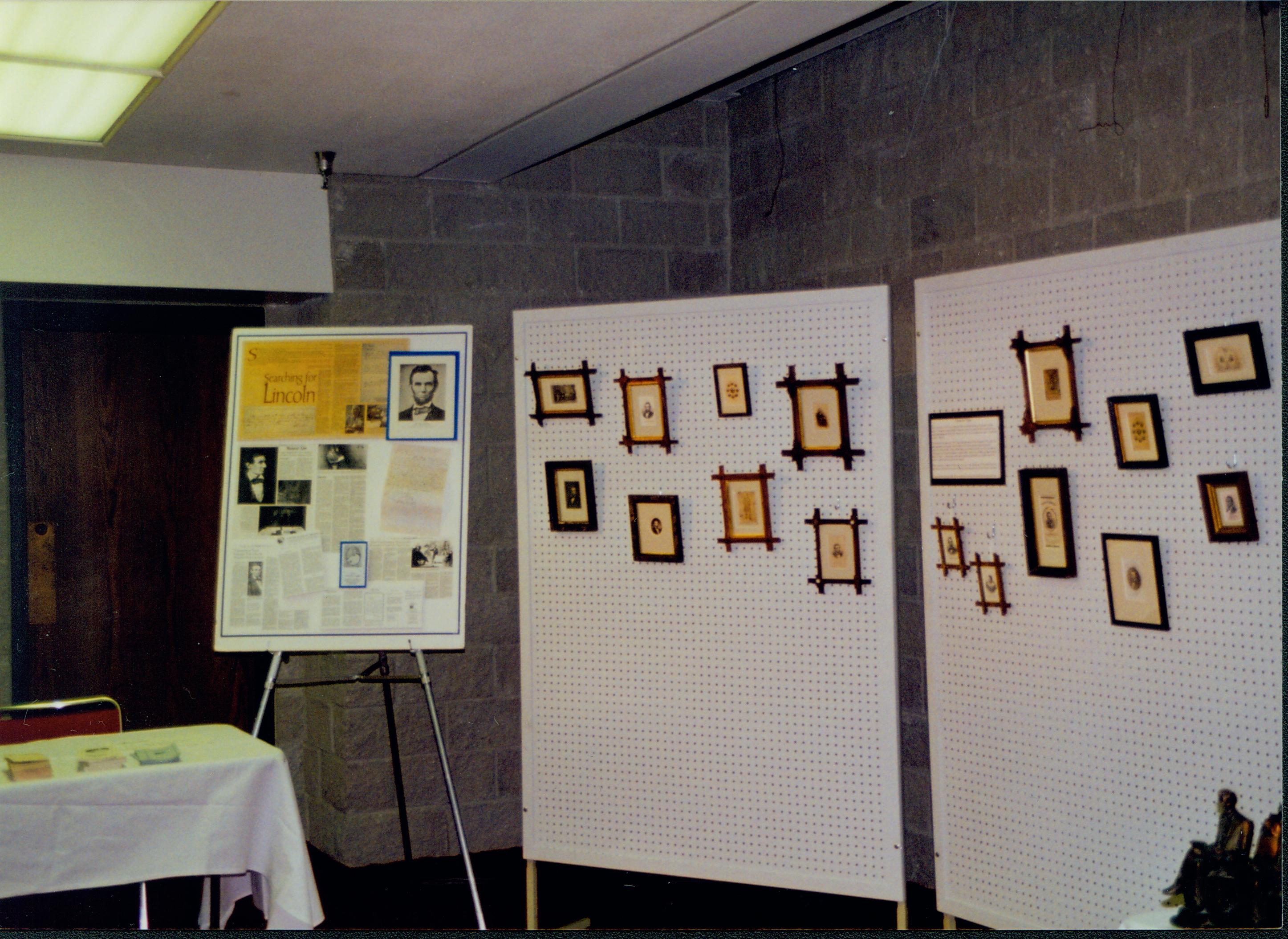 Jack Smith exhibit, framed art work hanging on peg board. 1-1997 Colloq (color); 32 Colloquium, 1997