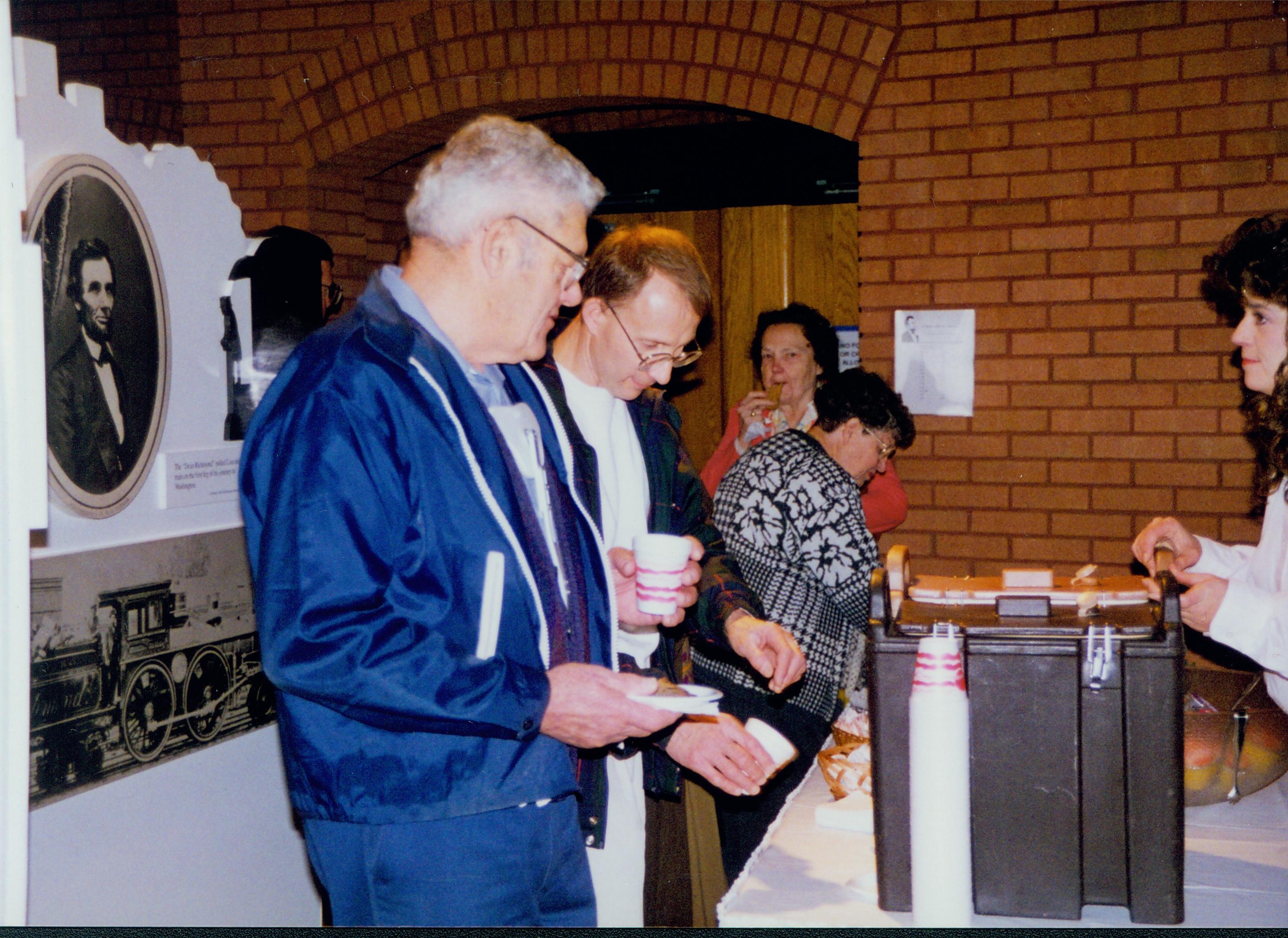 Guests getting refreshments. 1-1997 Colloq (color); 36 Colloquium, 1997