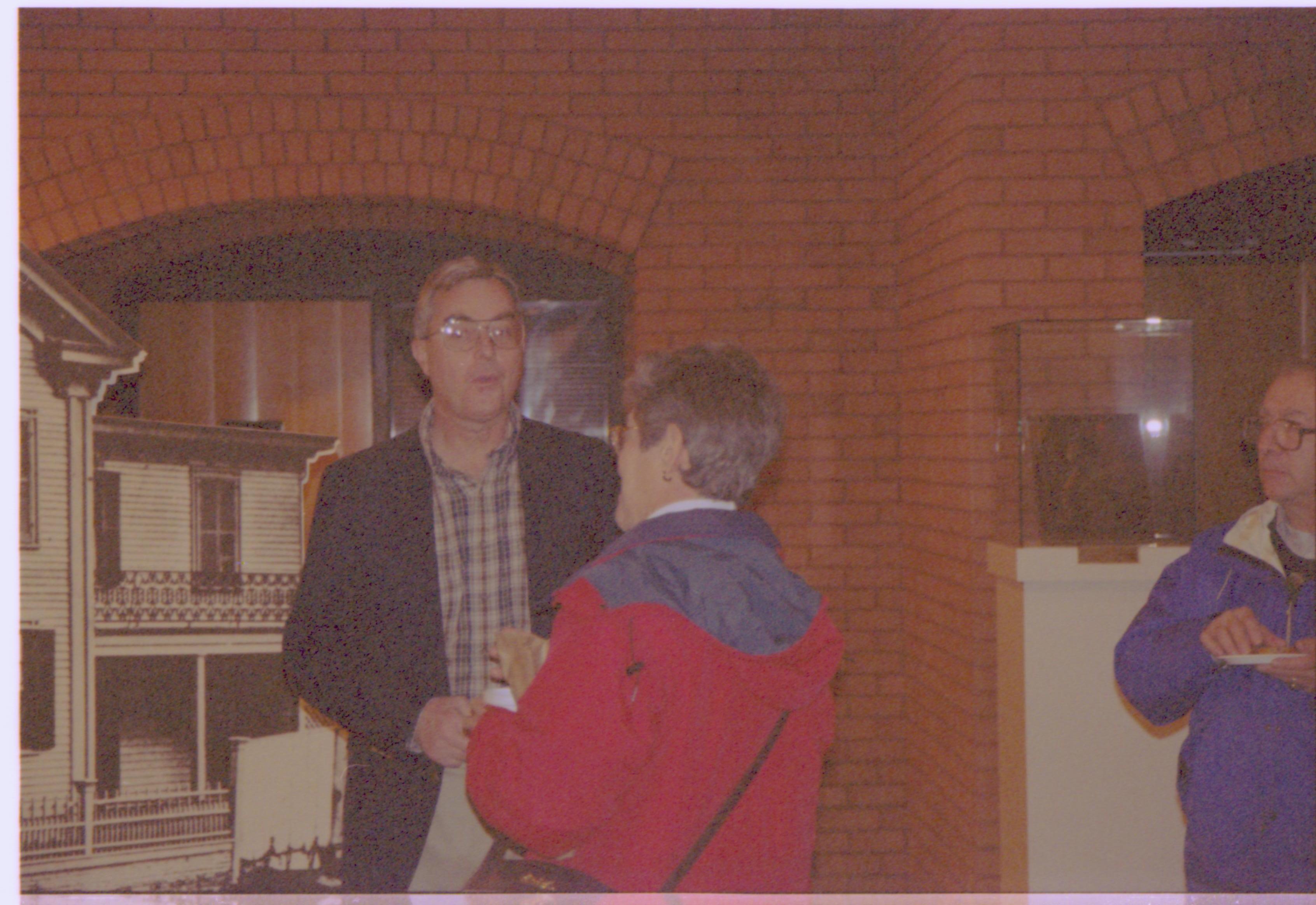 Norm Hellmers with guest in front of Home picture.  2-1997 Colloq (color); 2 Colloquium, 1997