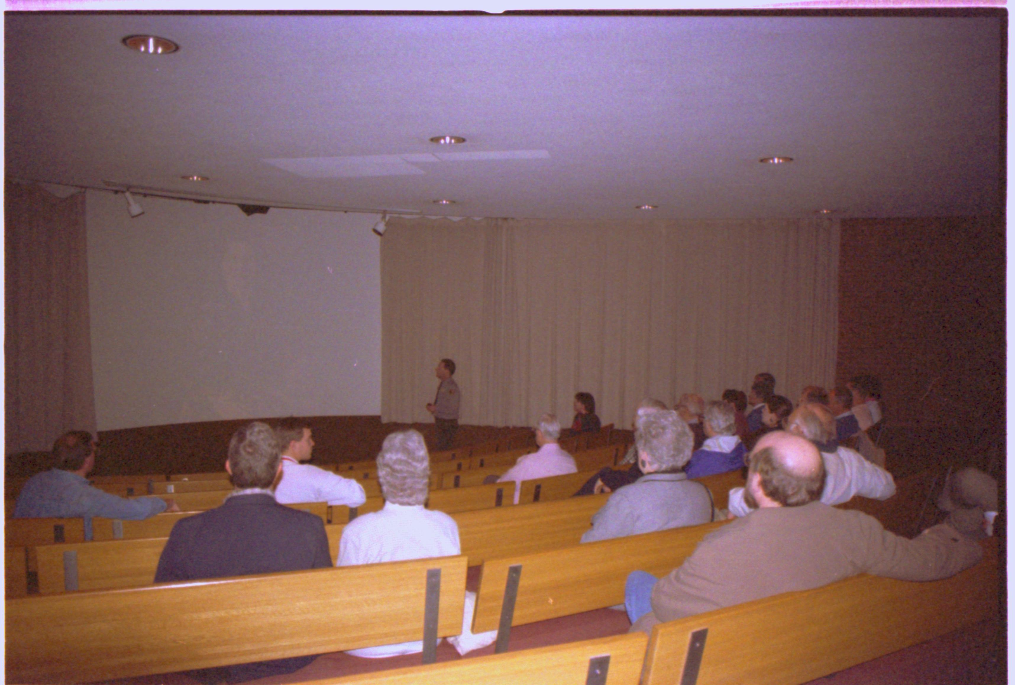 People listening to lecturer. Image on screen. 2-1997 Colloq (color); 16 Colloquium, 1997