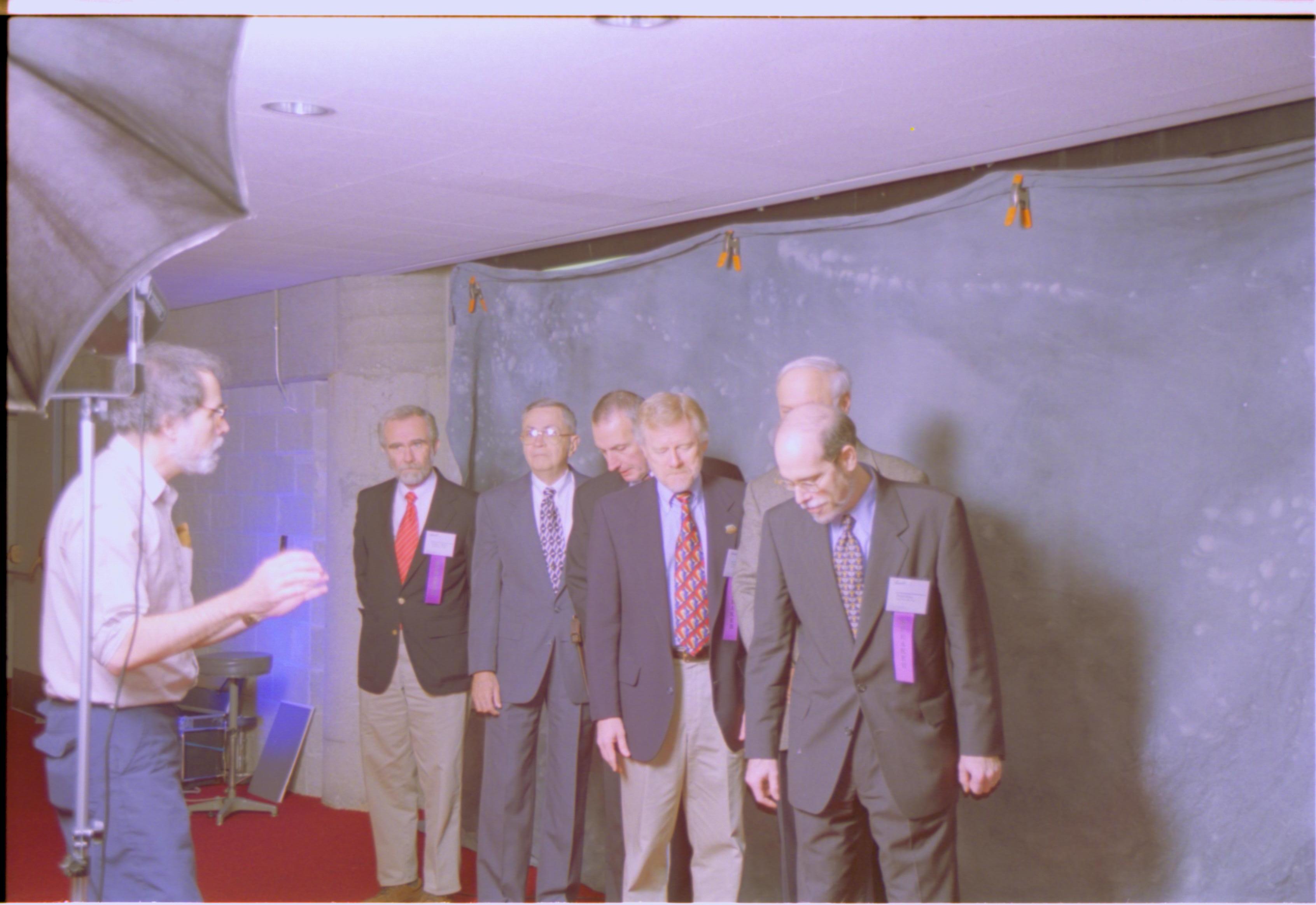 Speakers getting pictures taken 3-1997 Colloq (color); 14 Colloquium, 1997