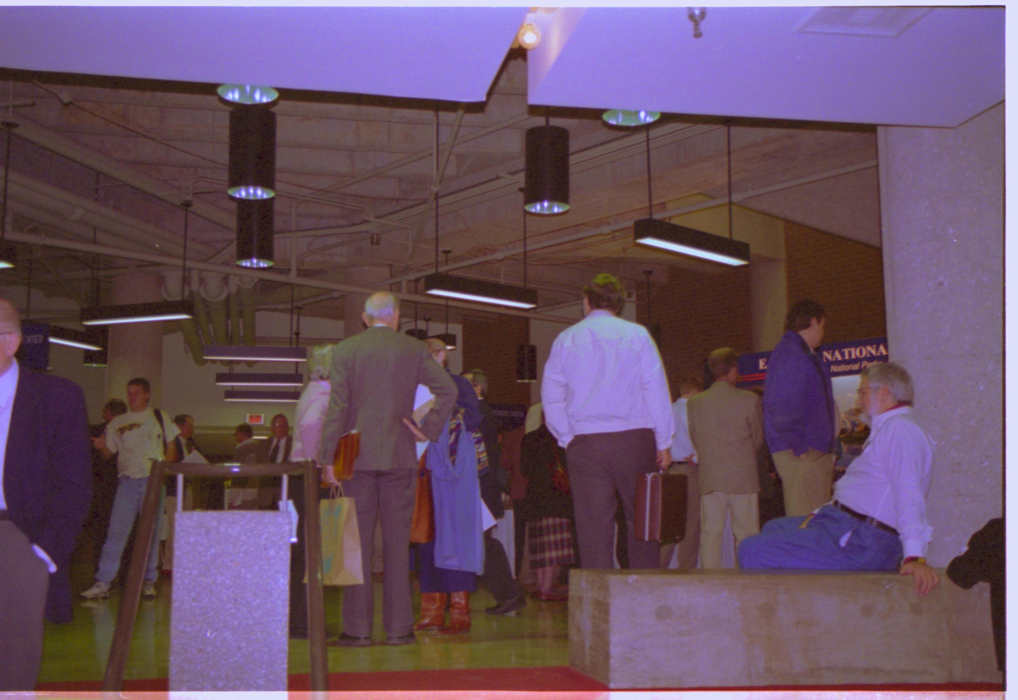 Attendees in exhibit hall. 3-1997 Colloq (color); 26 Colloquium, 1997