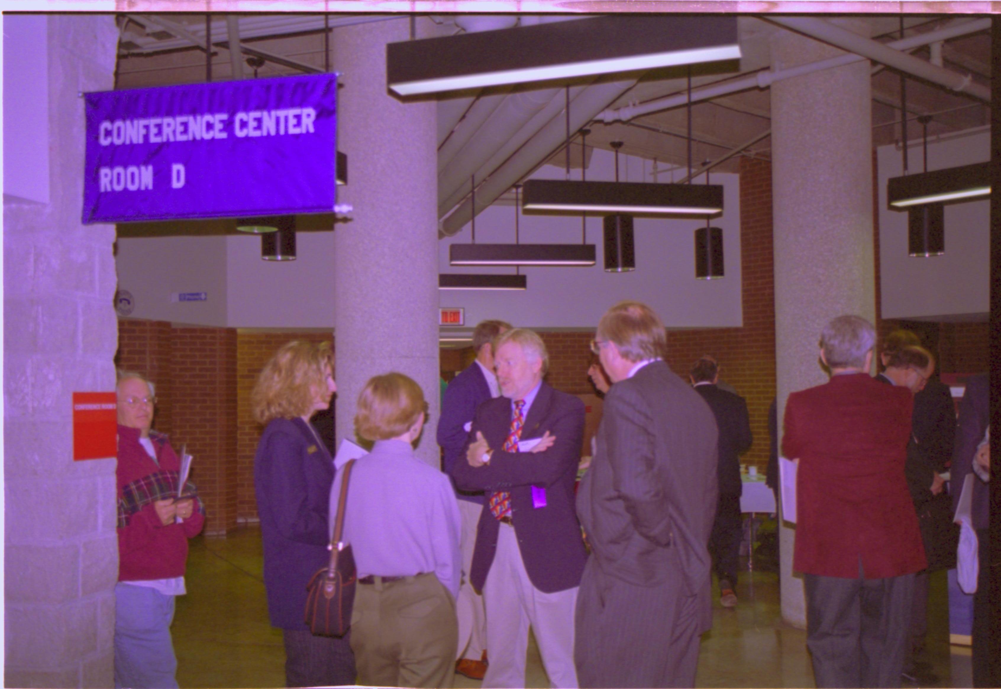 Larry Blake speaking with Pitcaithley and staff of Grant NHS 3-1997 Colloq (color); 30 Colloquium, 1997