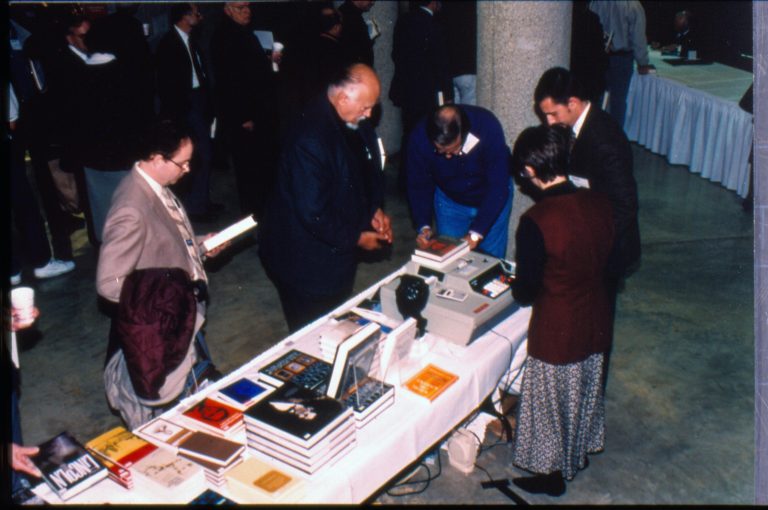 Attendees at book table. 1997 Colloq (color slides) Colloquium, 1997
