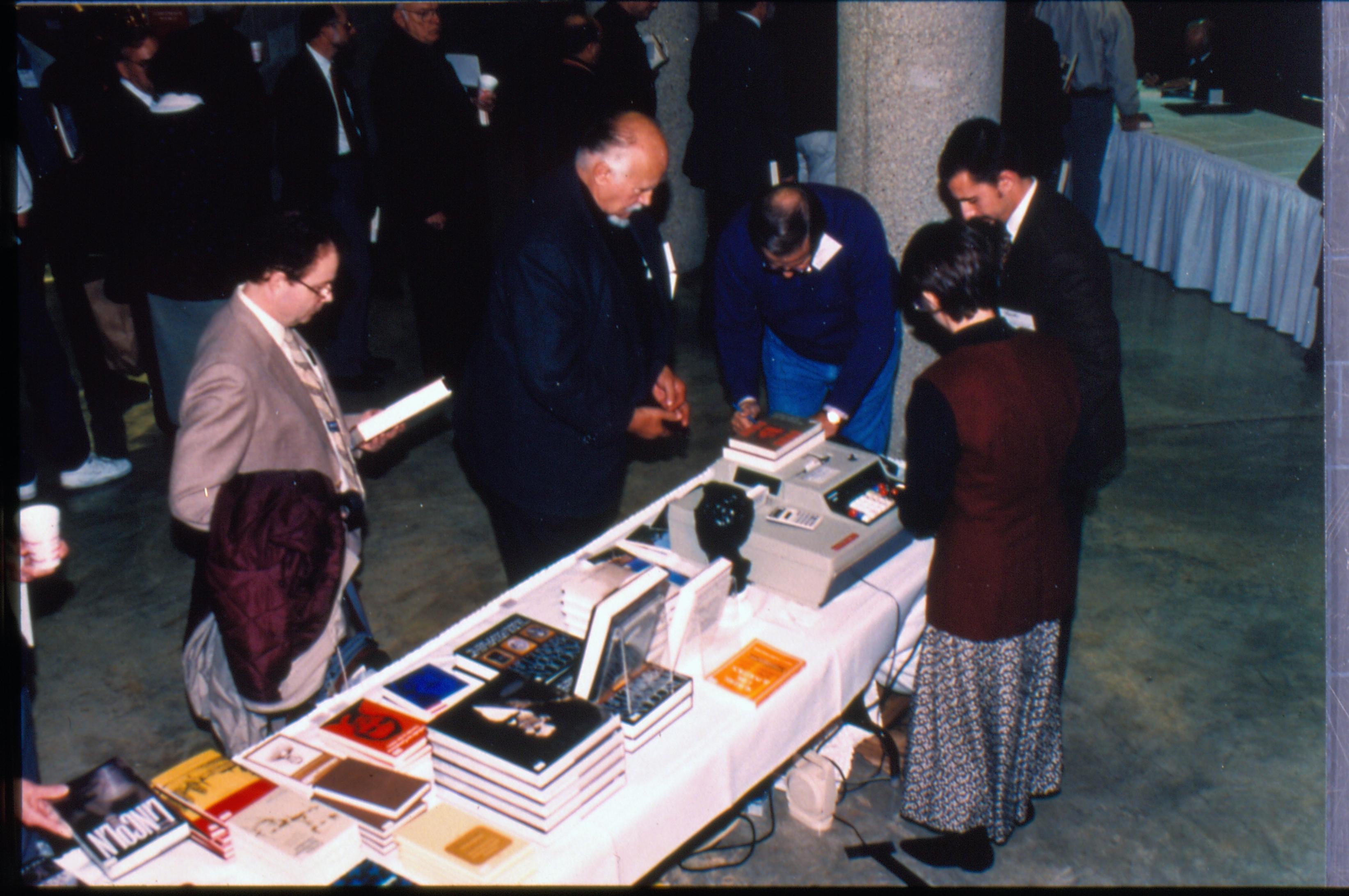 Attendees at book table. 1997 Colloq (color slides) Colloquium, 1997