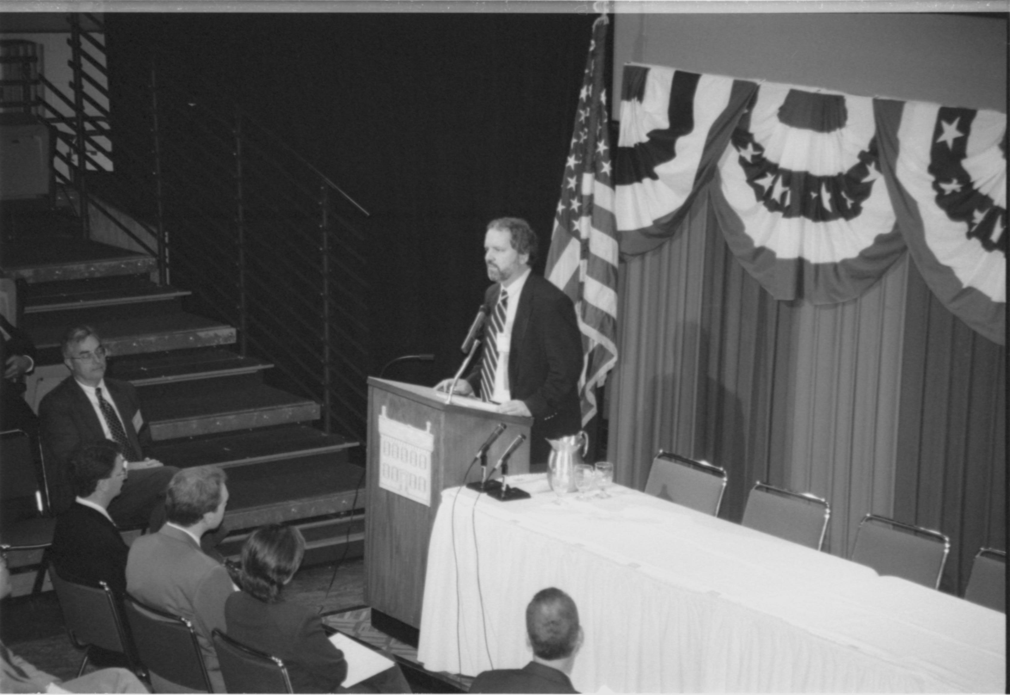 Speaker at podium. 1999-16; 18 Colloquium, 1999