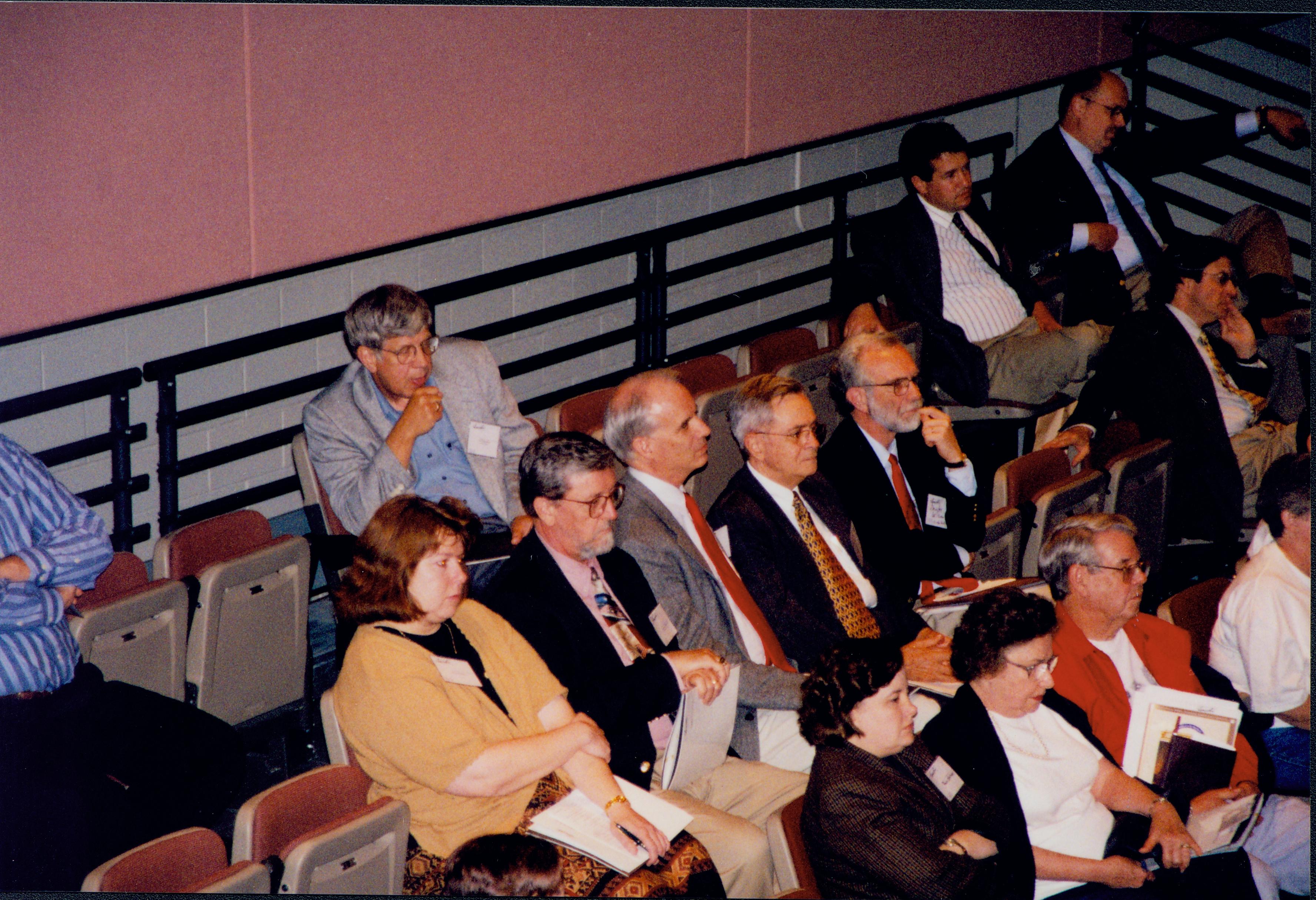 Audience seated on risers. 1999-12; 15 Colloquium, 1999