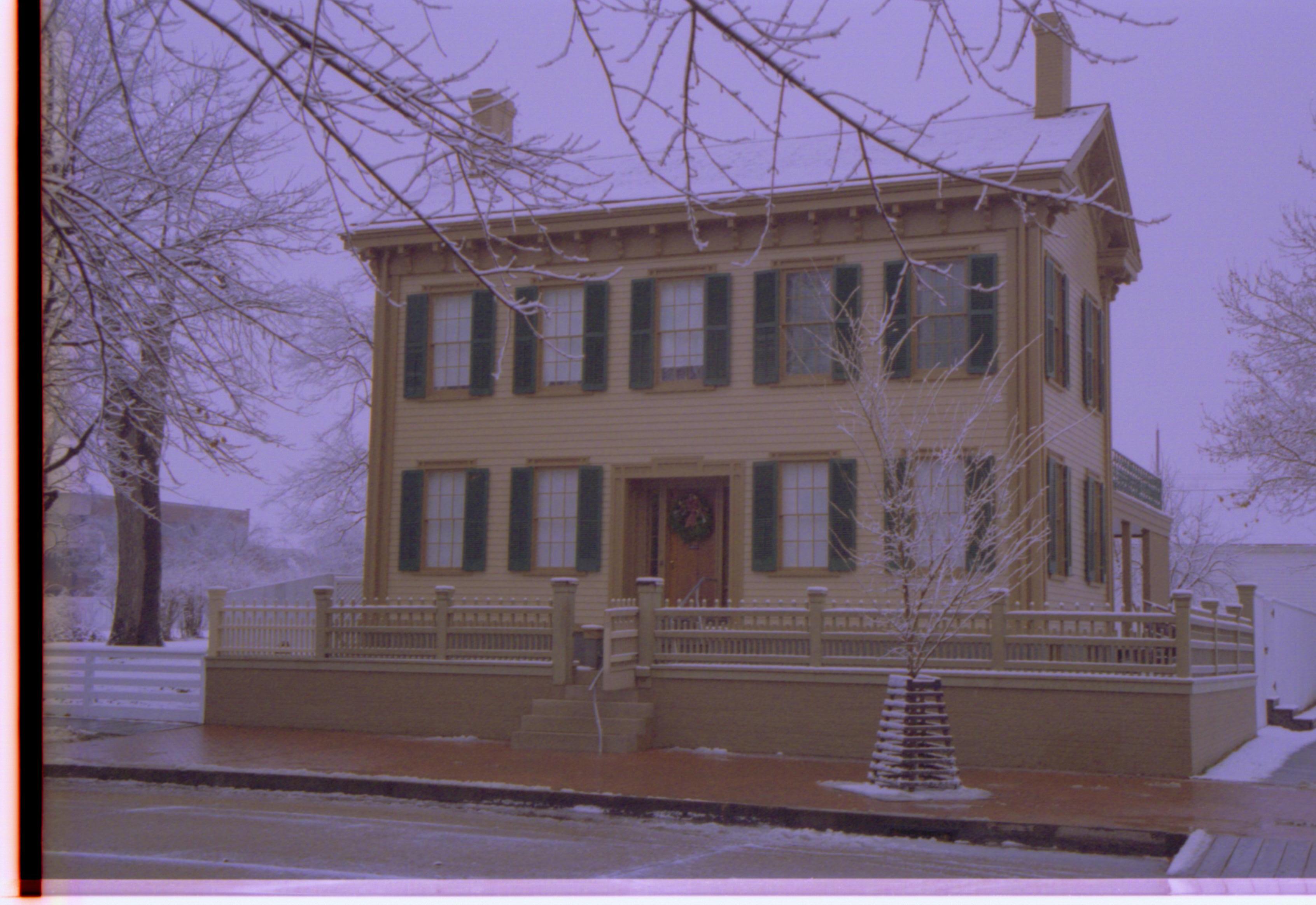 Home, front winter view. Holiday decorations Lincoln Home, Snow