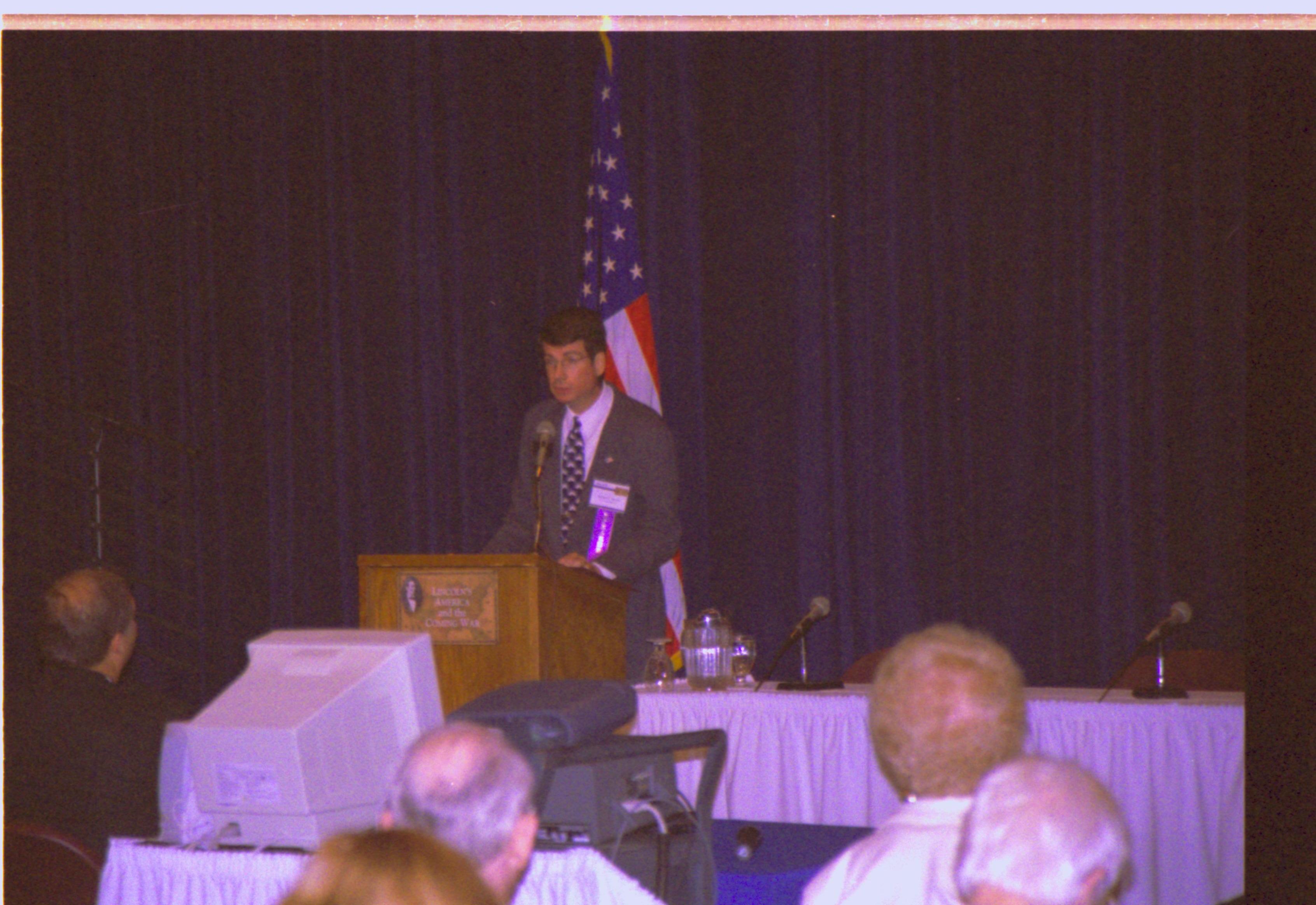 Speaker at podium Colloquium, 2001