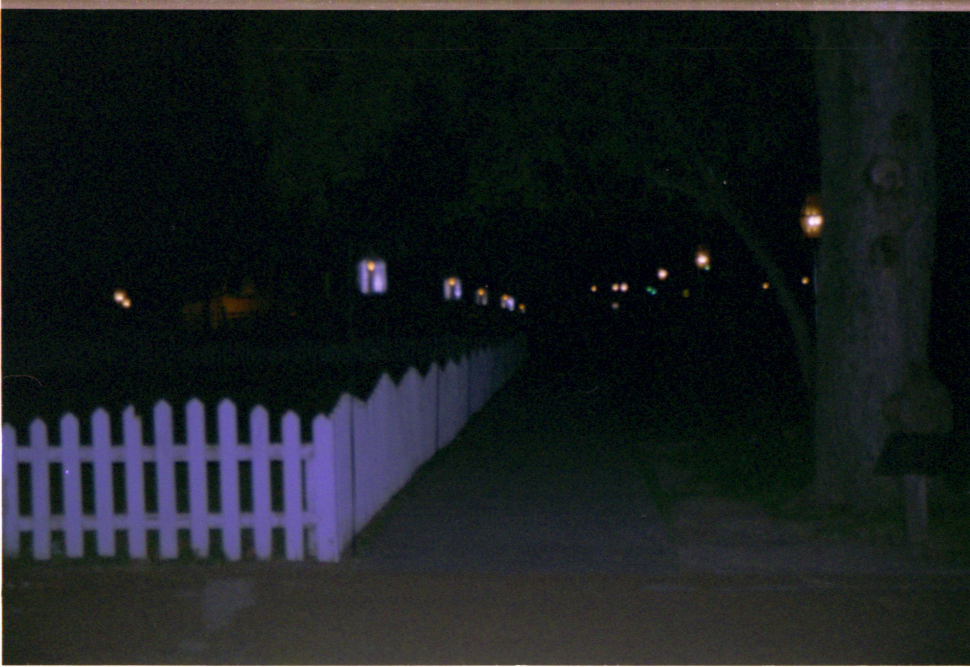 Lighted lanterns along sidewalk Candles