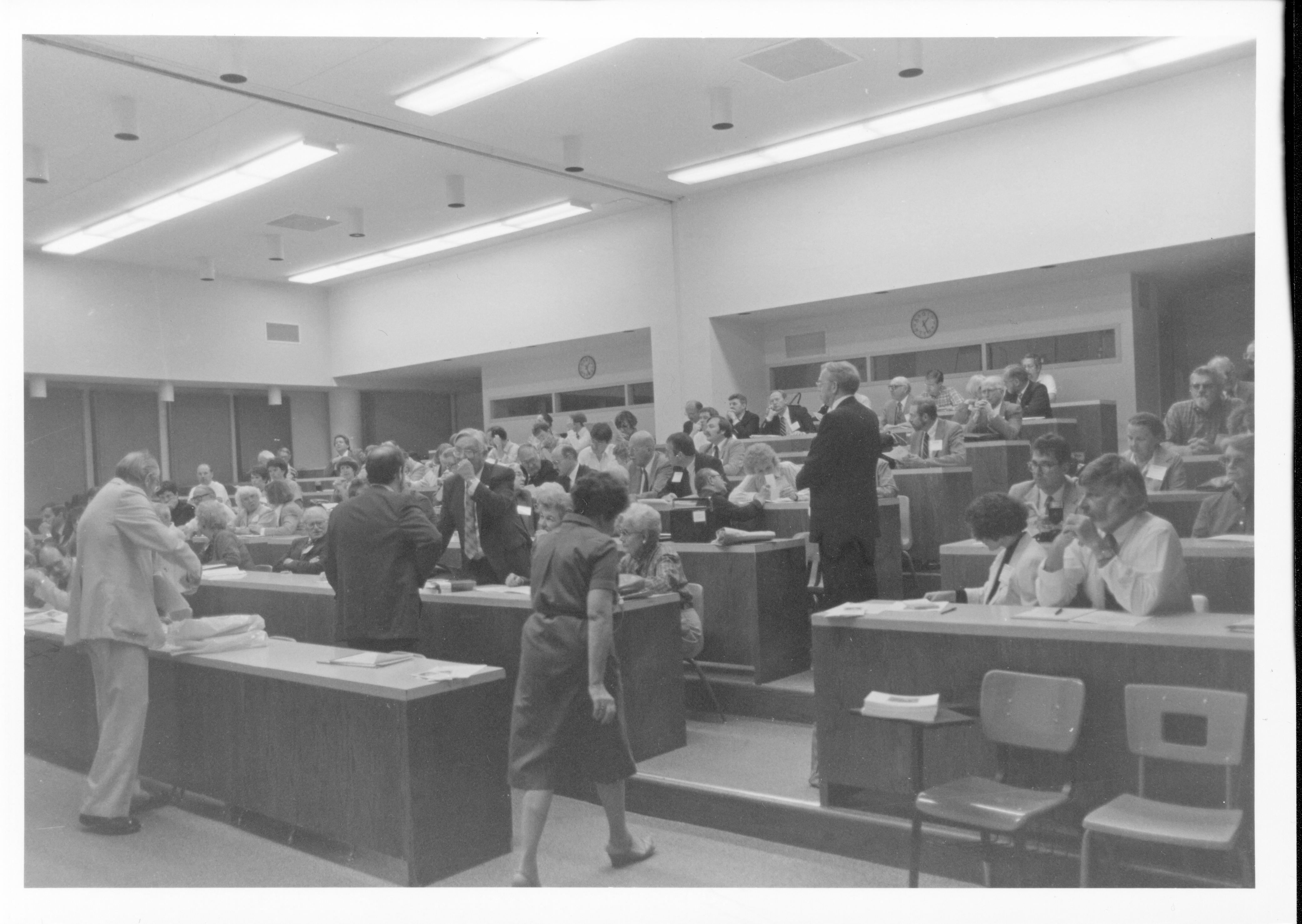 Group of people in large lecture room. Lincoln, Colloquium