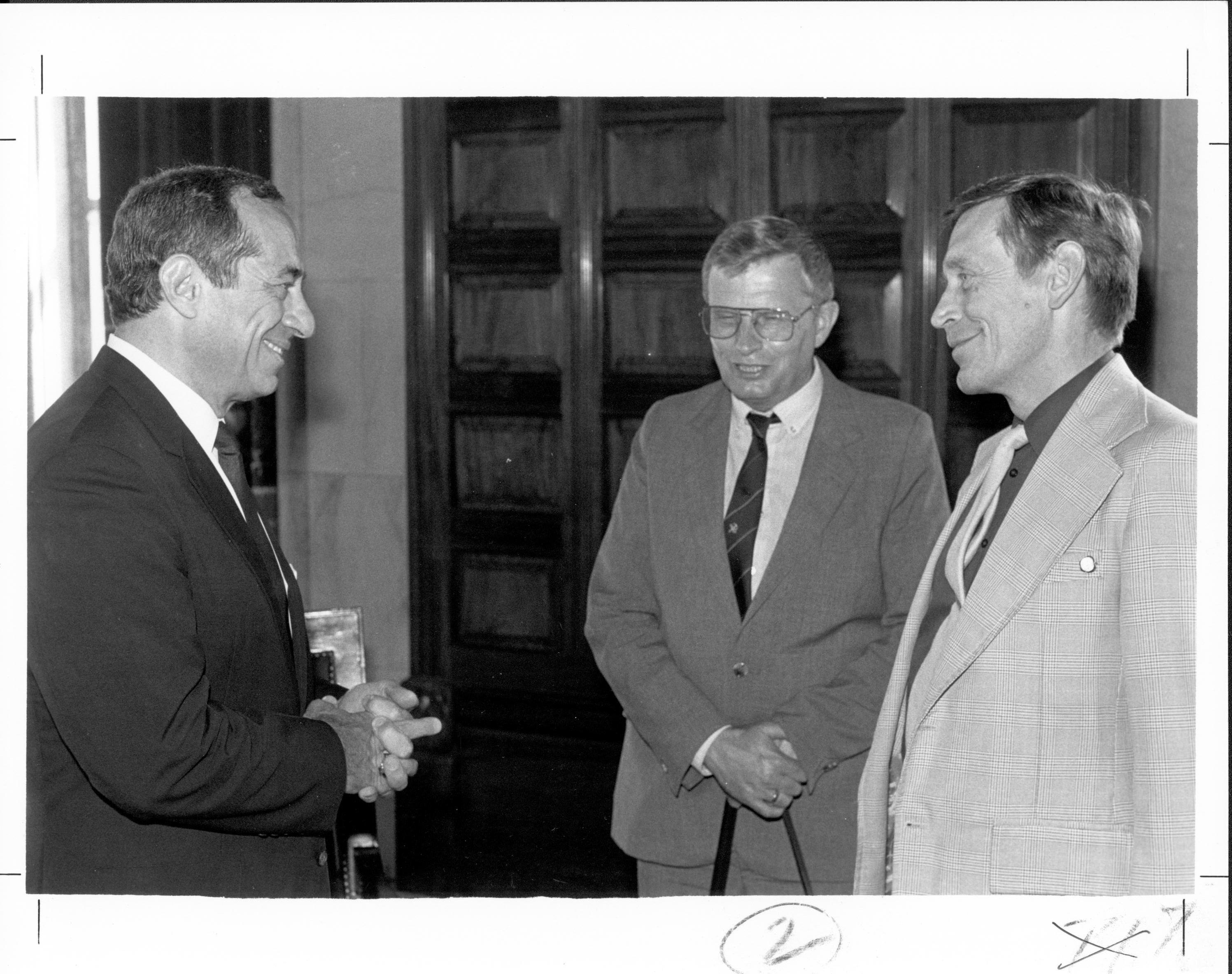 Three men talking 2 Lincoln, Colloquium