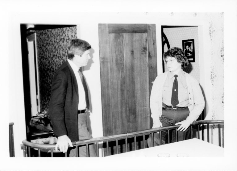 Man talking to Ranger behind railing in Home. Lincoln, Colloquium