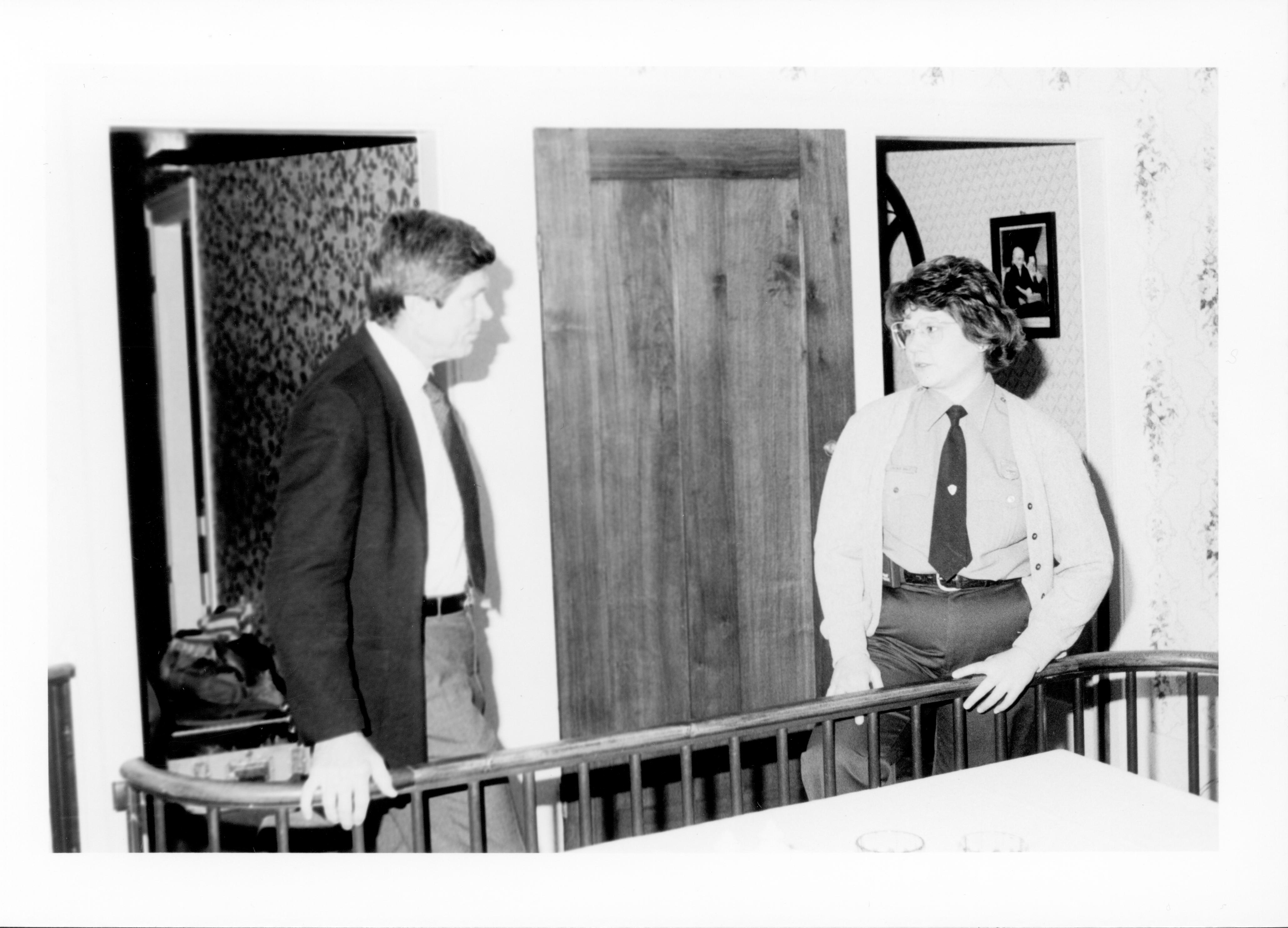 Man talking to Ranger behind railing in Home. Lincoln, Colloquium