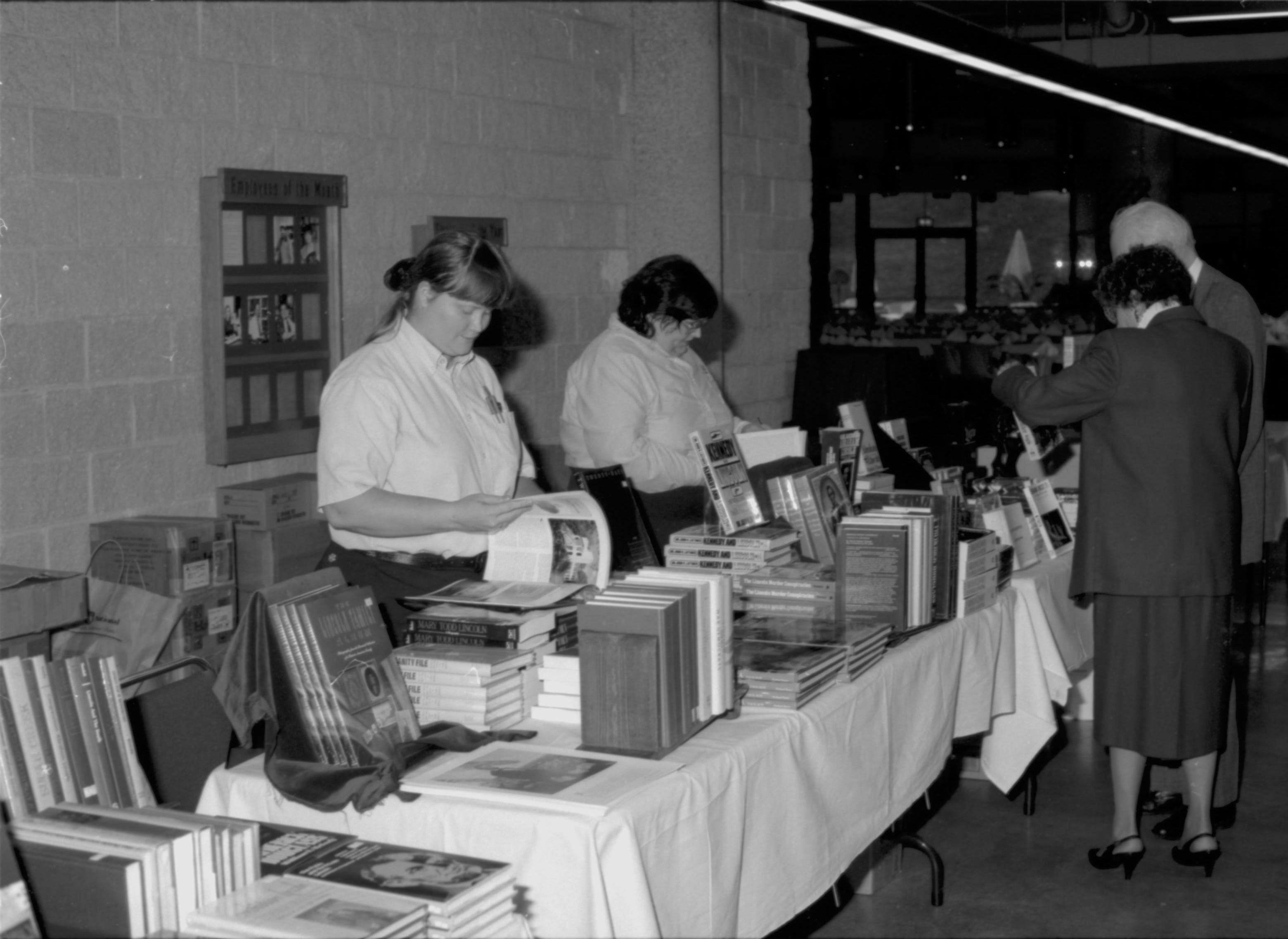 Two ladies behind book table. Colloquium, 1991 Lincoln, Colloquium