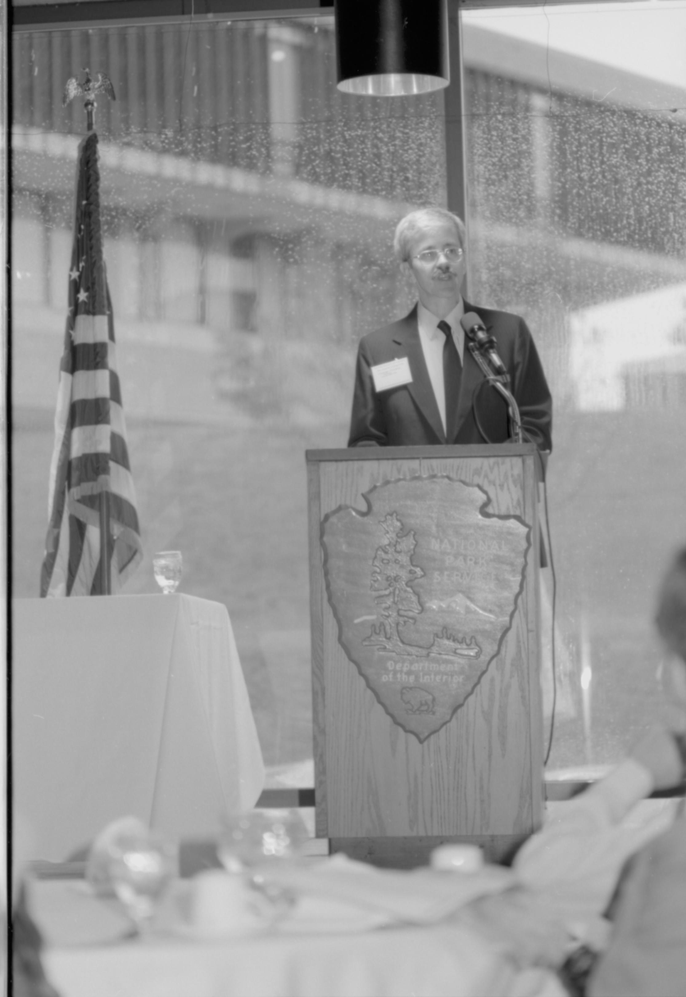 Man behind NPS podium speaking. Colloquium, 1991 Lincoln, Colloquium