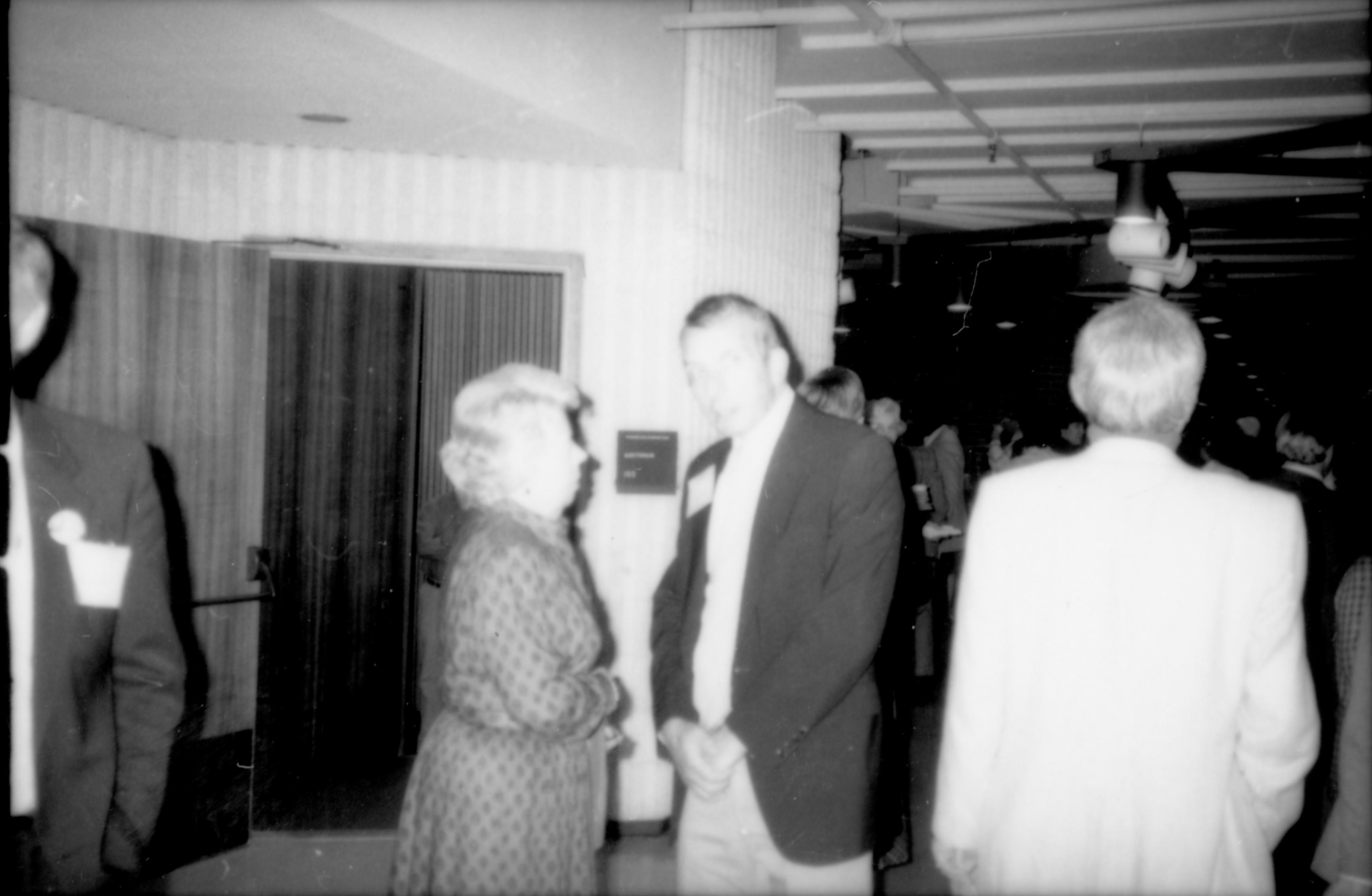 Man and woman standing, conversing 1992 Lincoln Colloquium Lincoln, Colloquium