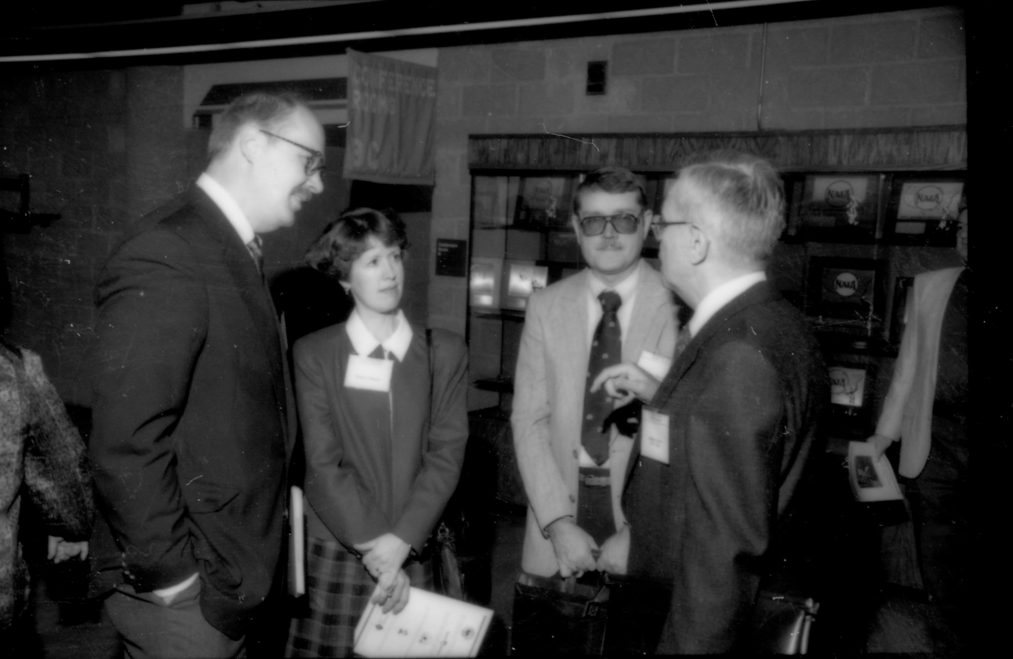 Three people listening to a fourth. 1992 Lincoln Colloquium; Outside #72 Lincoln, Colloquium