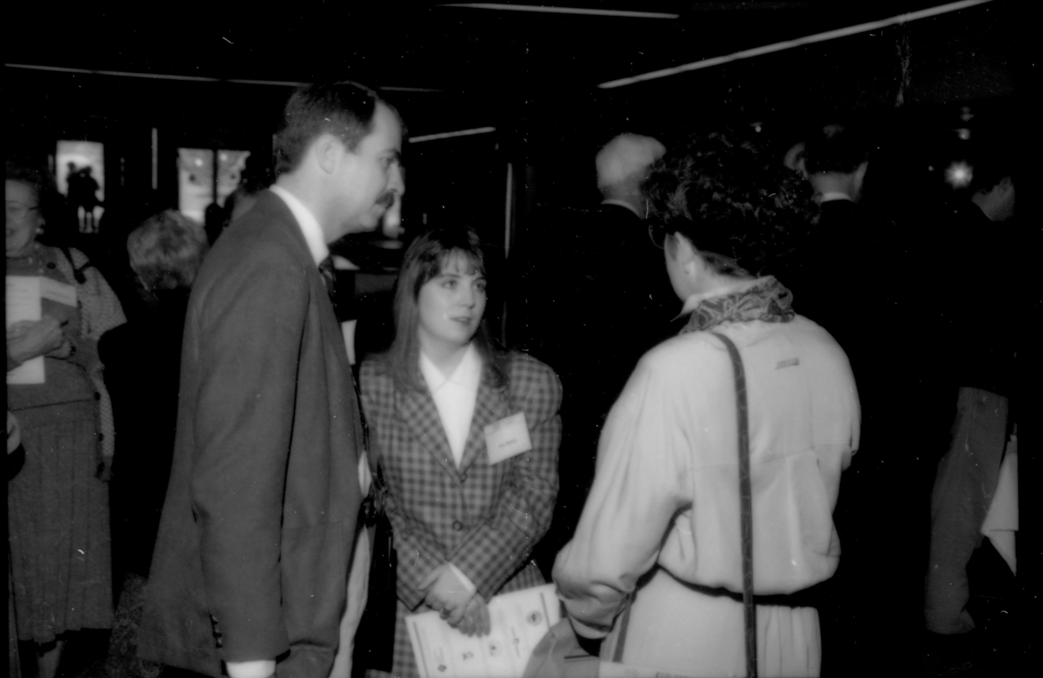 Two ladies and a man talking. 1992 Lincoln Colloquium; Outside #72 Lincoln, Colloquium