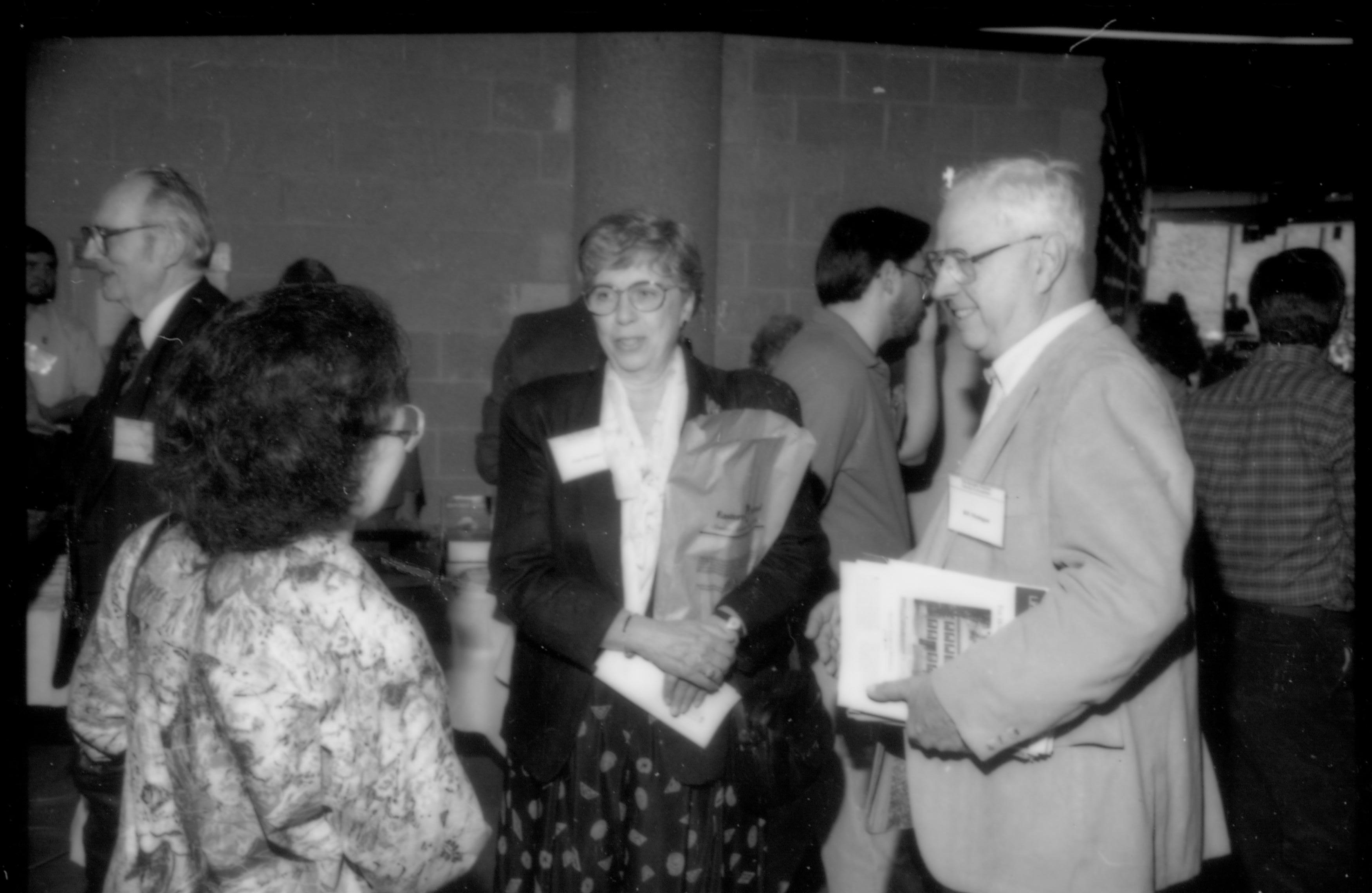 Attendees talking to one another 1992 Lincoln Colloquium; Outside #72 Lincoln, Colloquium