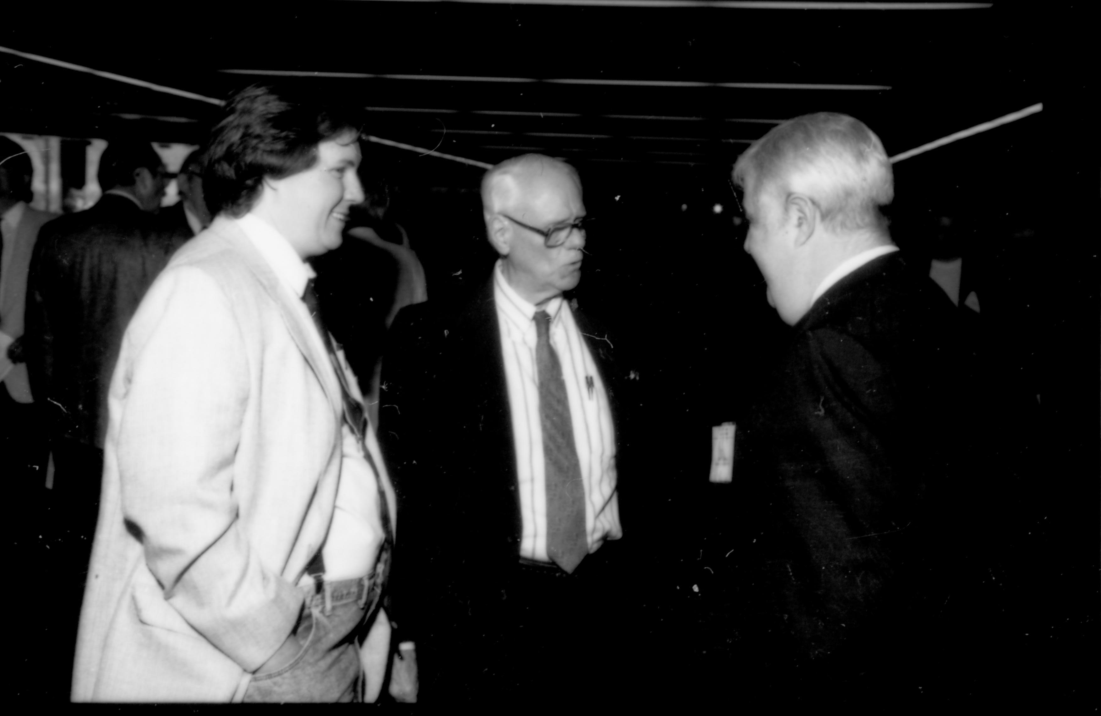 Two men talking to one of the speakers. 1992 Lincoln Colloquium; Outside #71 Lincoln, Colloquium