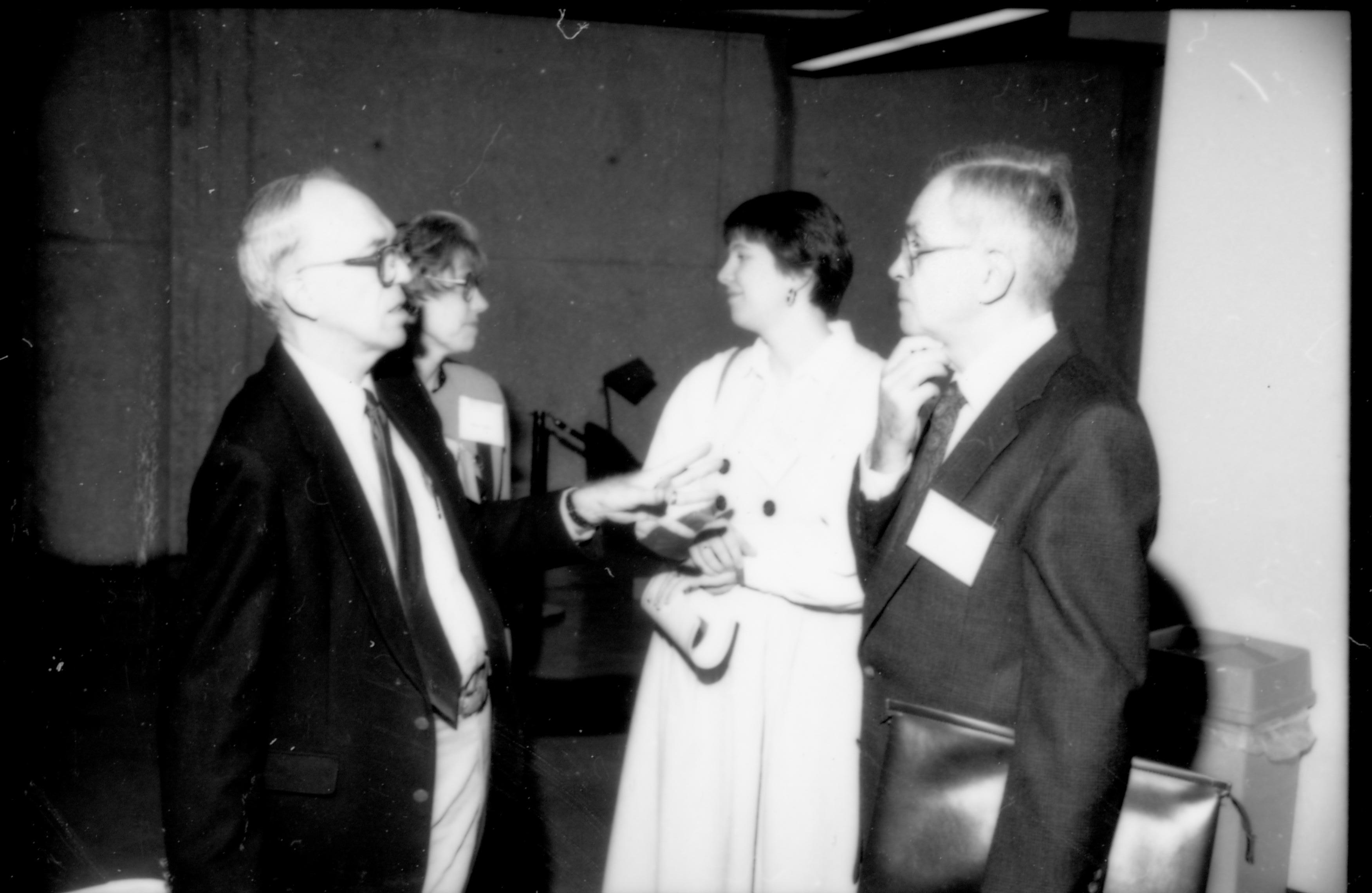 Man talking to one of the speakers. 1992 Lincoln Colloquium; Outside #71 Lincoln, Colloquium