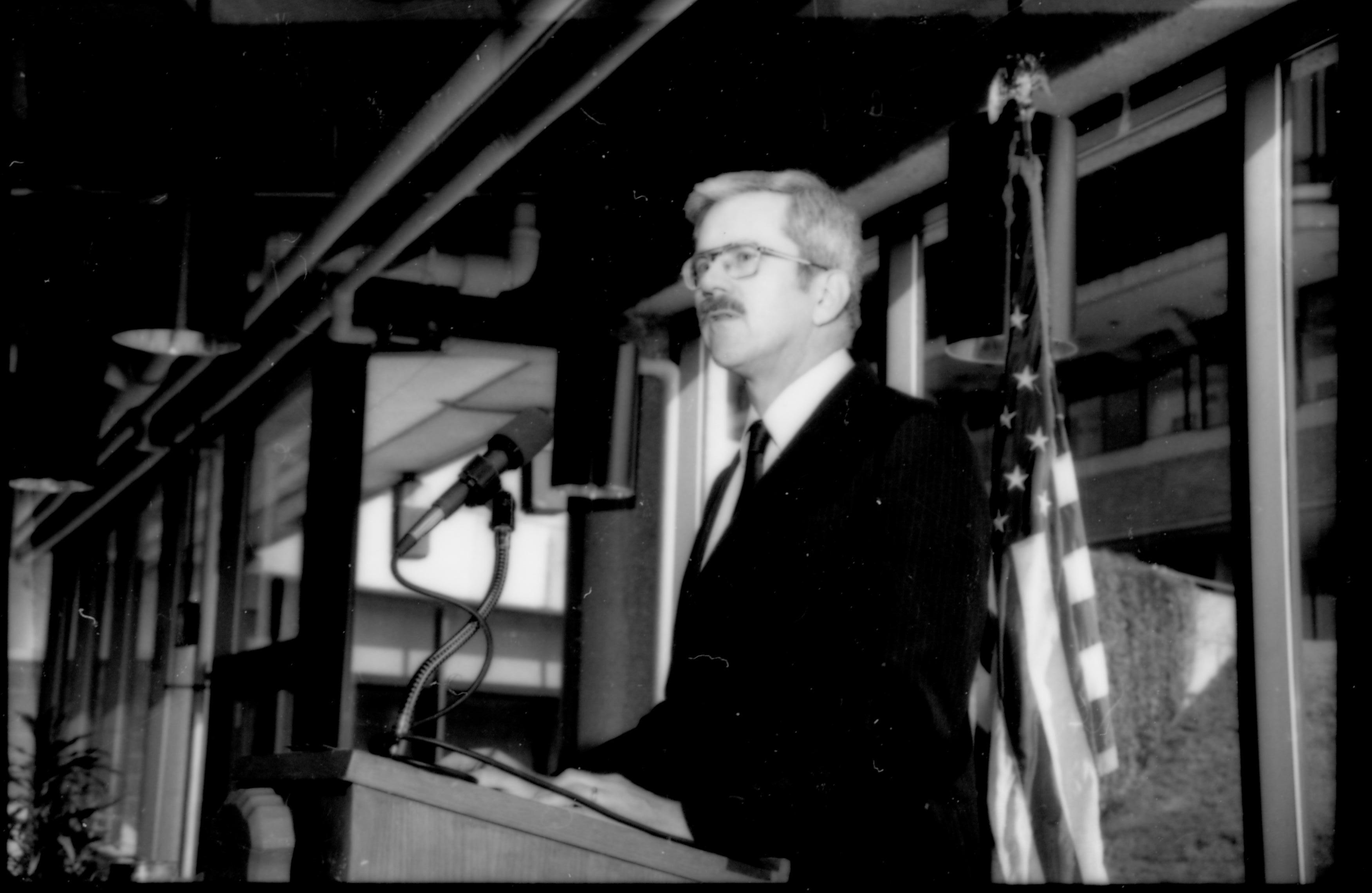 Close up of man at podium. 1992 Lincoln Colloquium; Outside #71 Lincoln, Colloquium