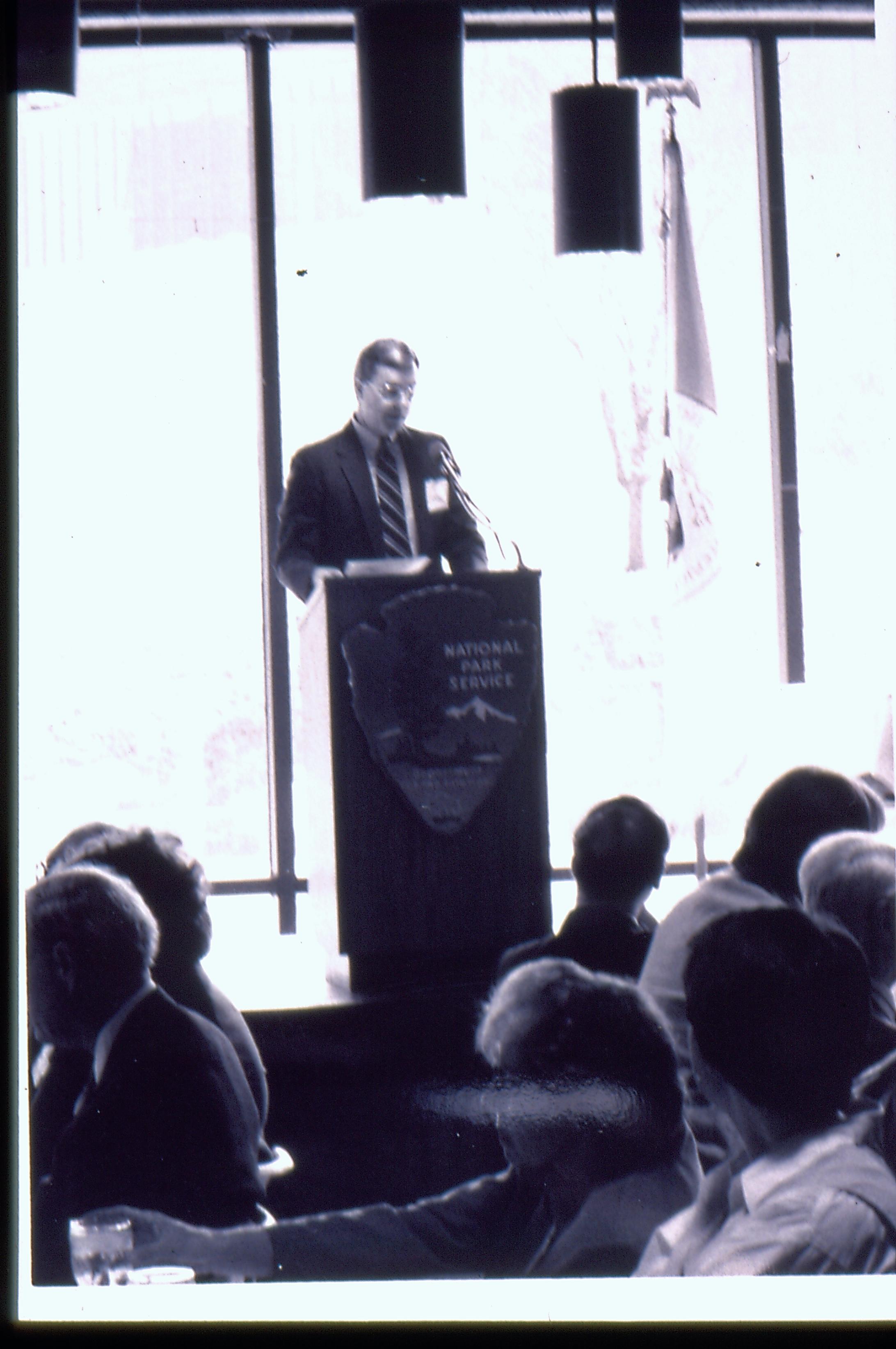 Distant shot of speaker (with windows behind him). 1992 Lincoln Colloquium Lincoln, Colloquium