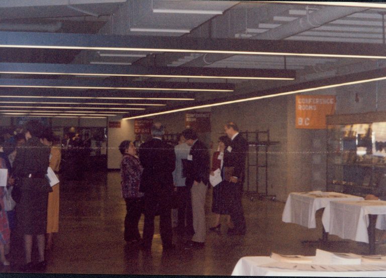 Attendees talking to one another in hallway. 1992 Lincoln Colloquium Lincoln, Colloquium