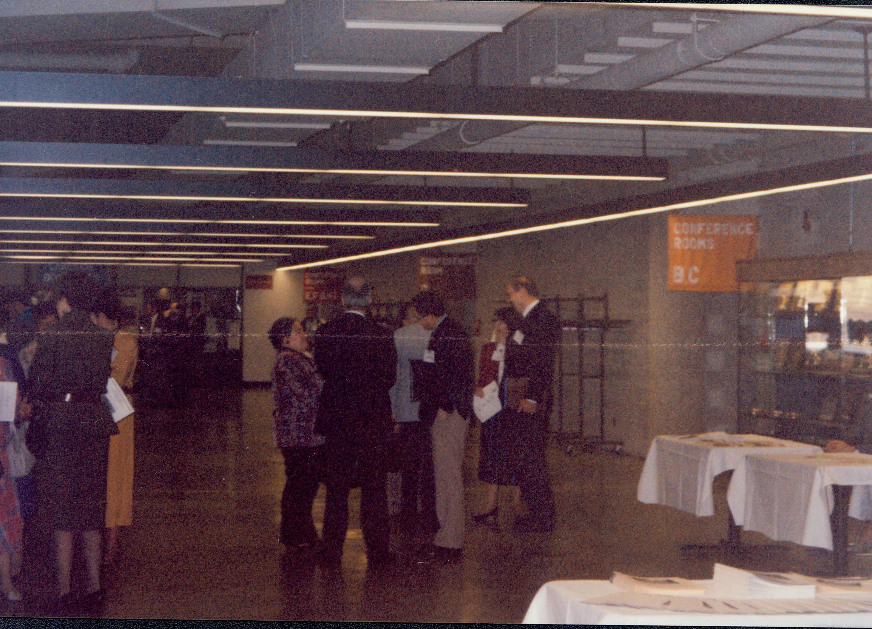 Attendees talking to one another in hallway. 1992 Lincoln Colloquium Lincoln, Colloquium