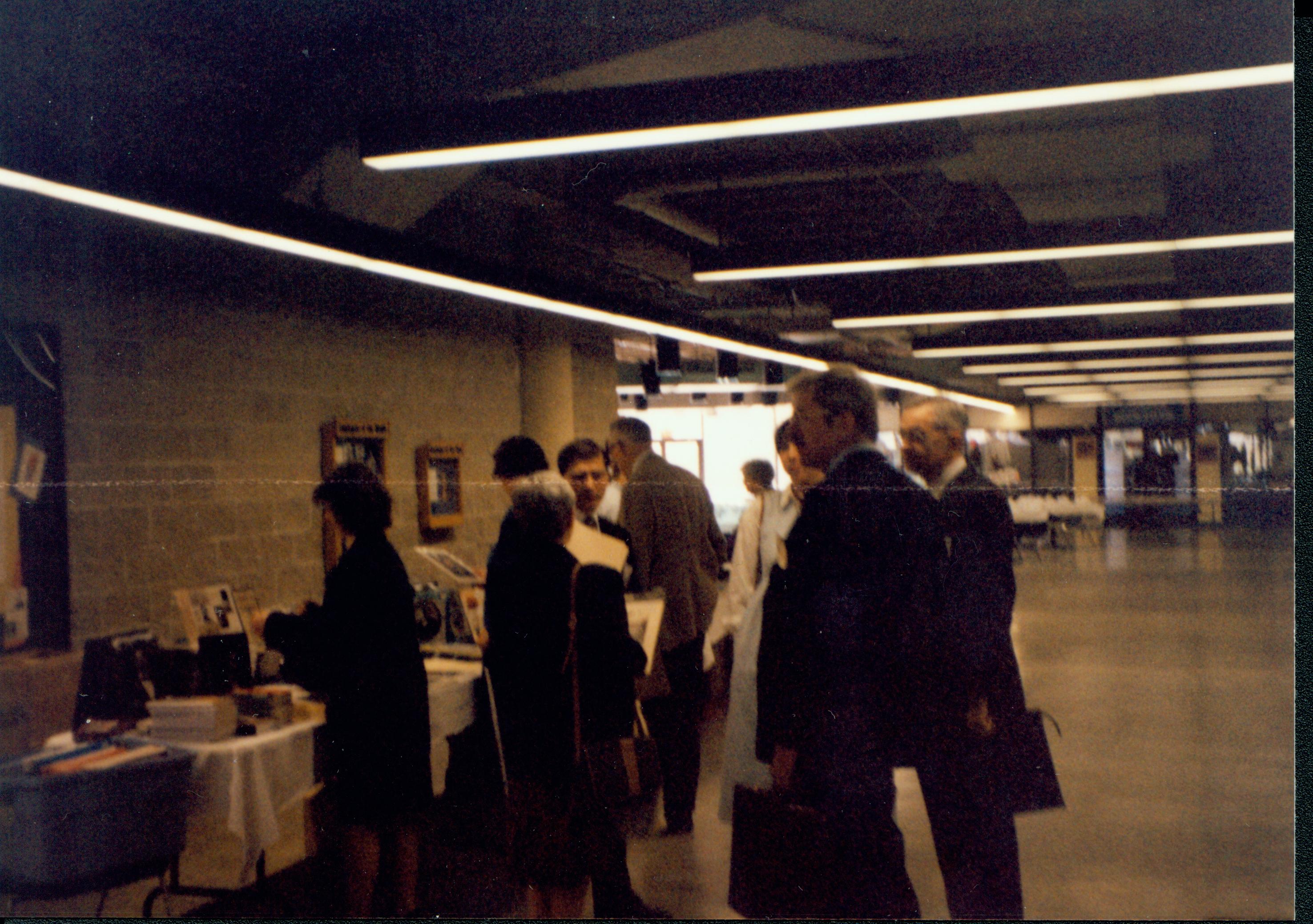 People at book tables in hallway. 1992 Lincoln Colloquium Lincoln, Colloquium