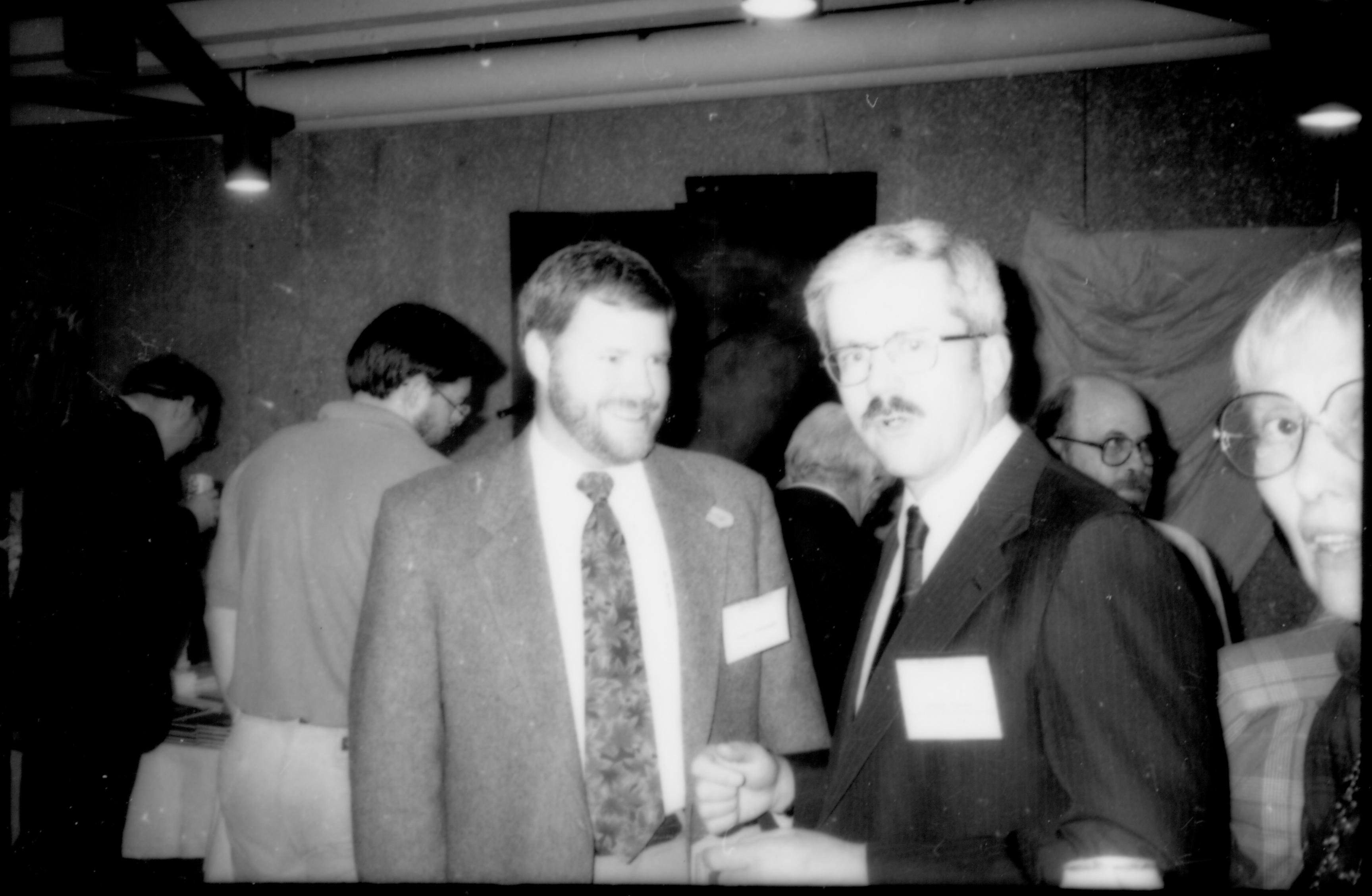Two men and woman standing. 1992 Lincoln Colloquium Lincoln, Colloquium