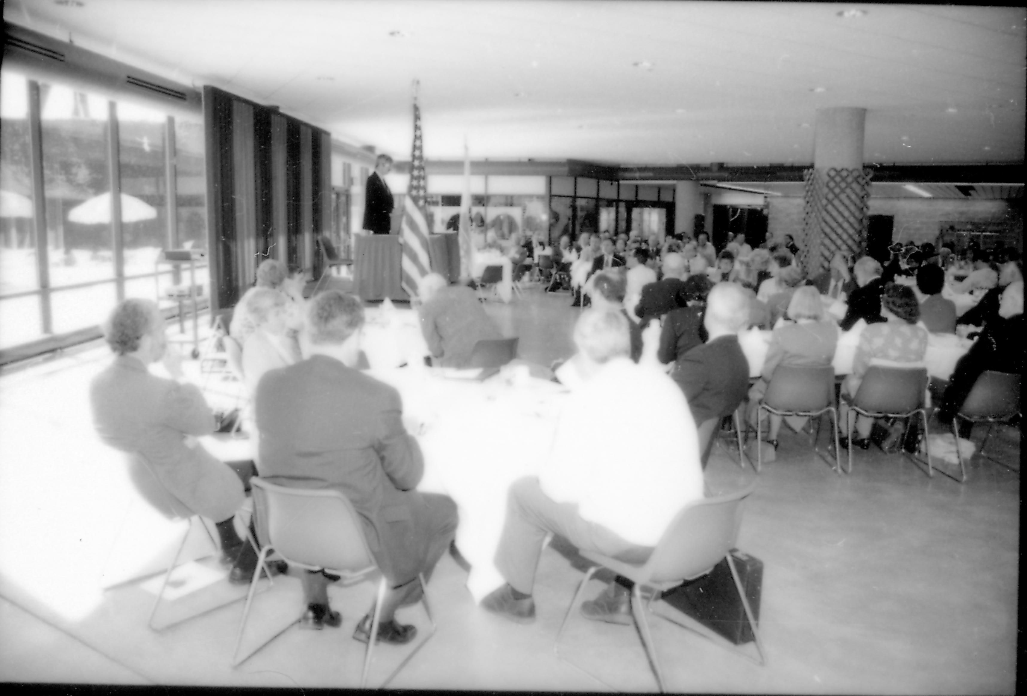 People in dining area listening to speaker. 8th Annual Lincoln Colloquium; A Lincoln, Colloquium