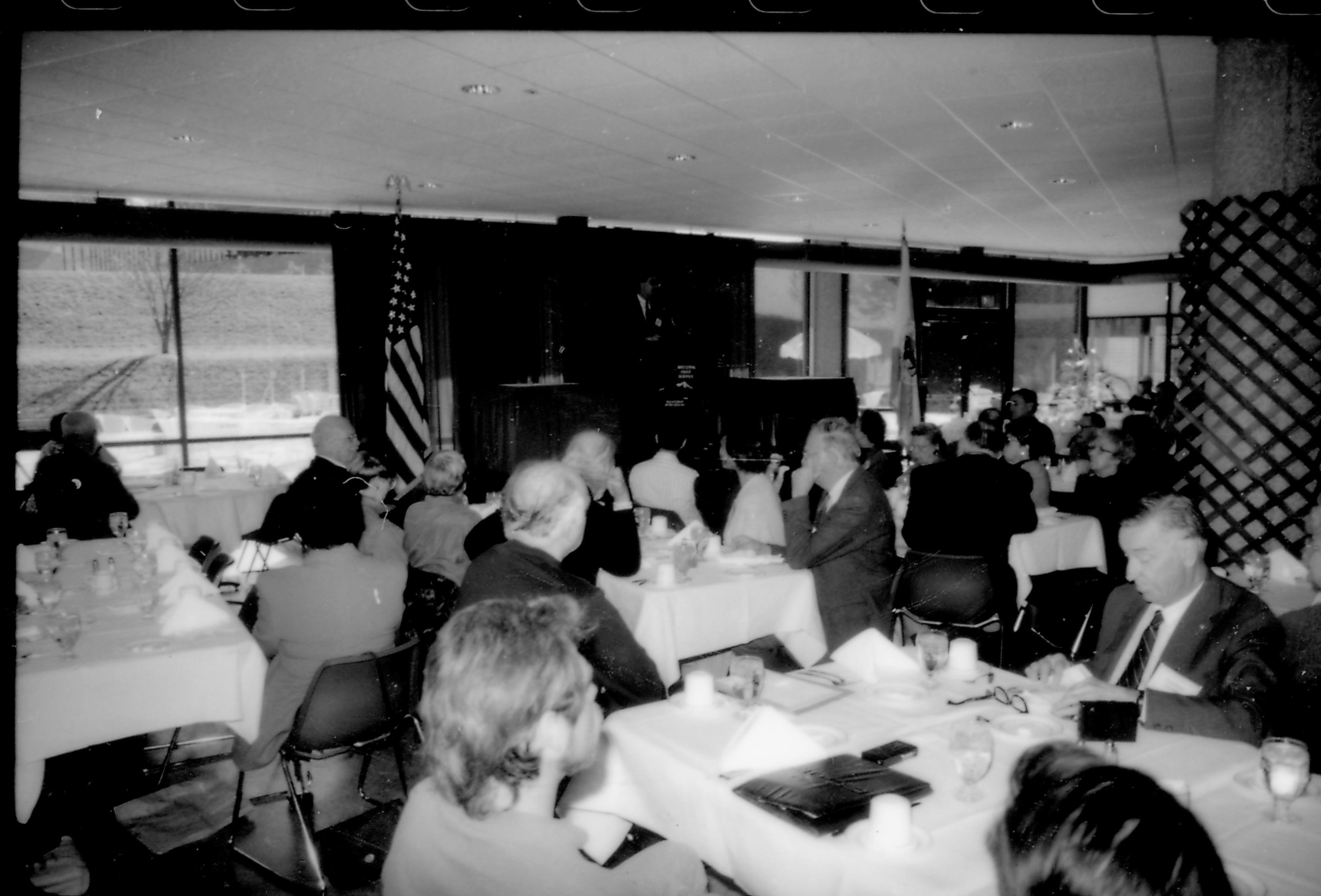 People in dining area listening to speaker. 8th Annual Lincoln Colloquium; B Lincoln, Colloquium