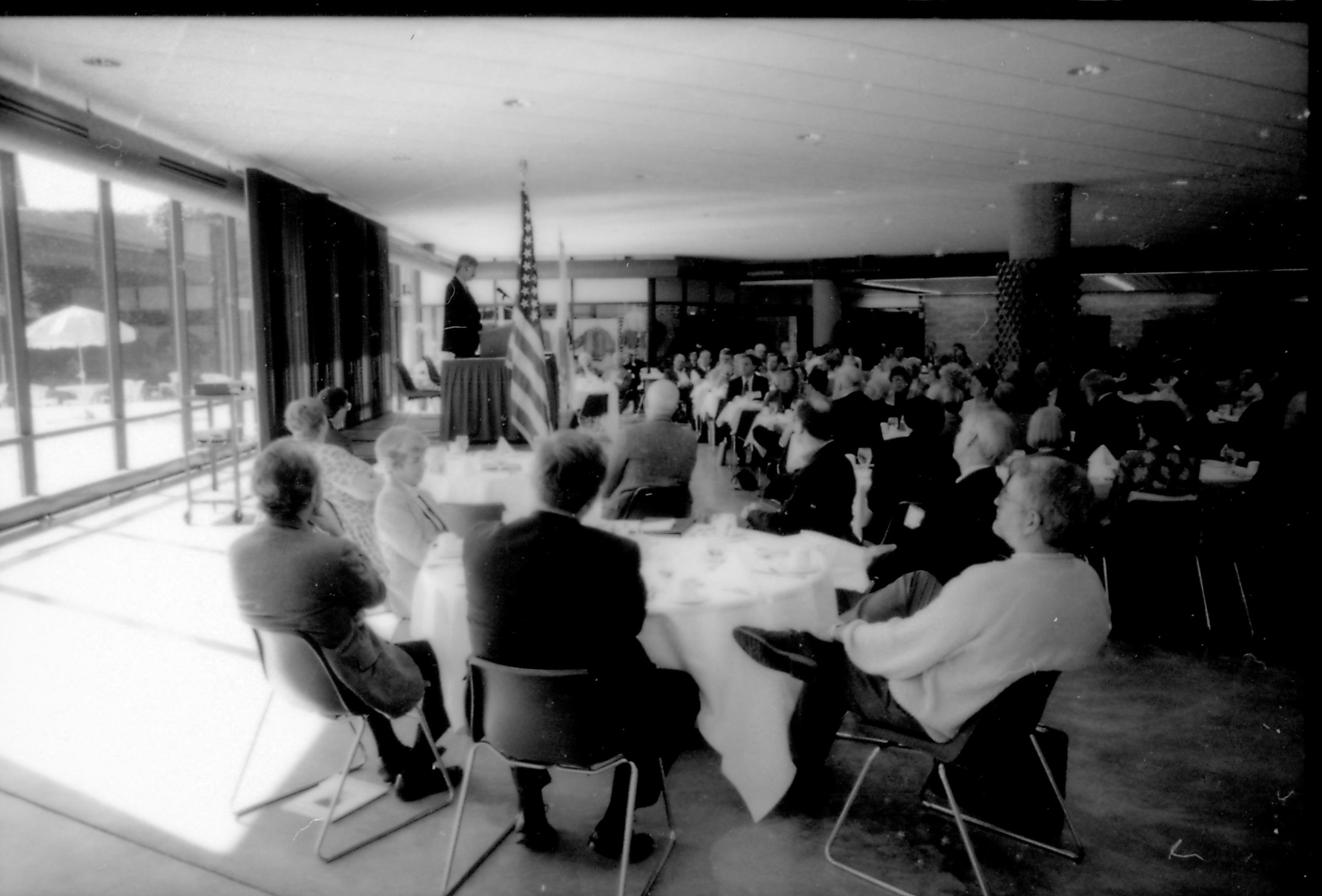 People in dining area (off to the side), listening to speaker. 8th Annual Lincoln Colloquium; B Lincoln, Colloquium