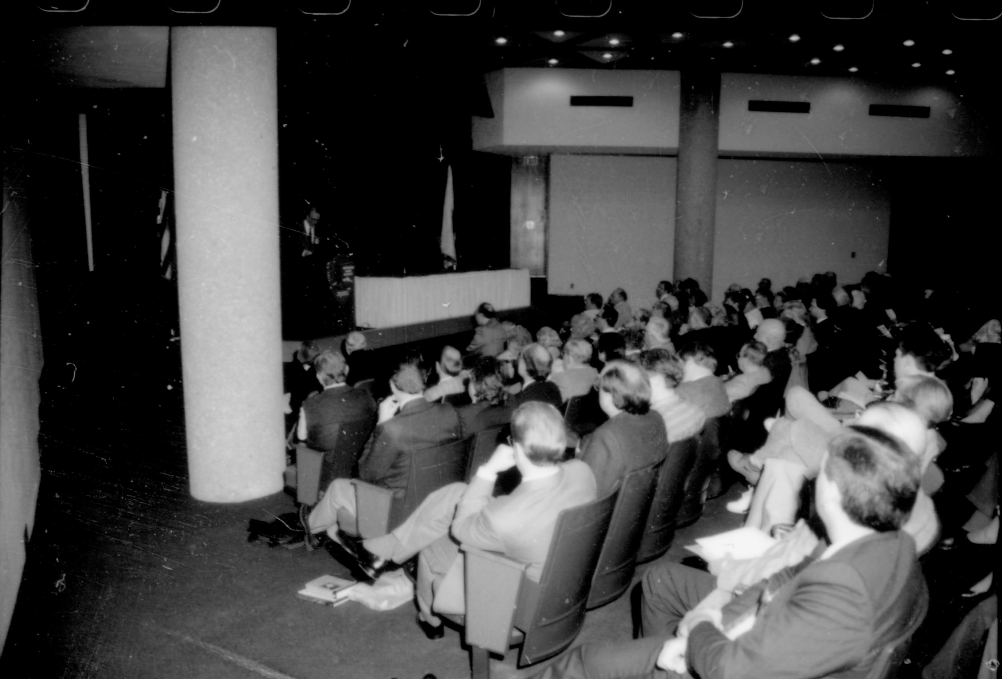 People, seated in lecture room, listening to speaker. 8th Annual Lincoln Colloquium; E Lincoln, Colloquium