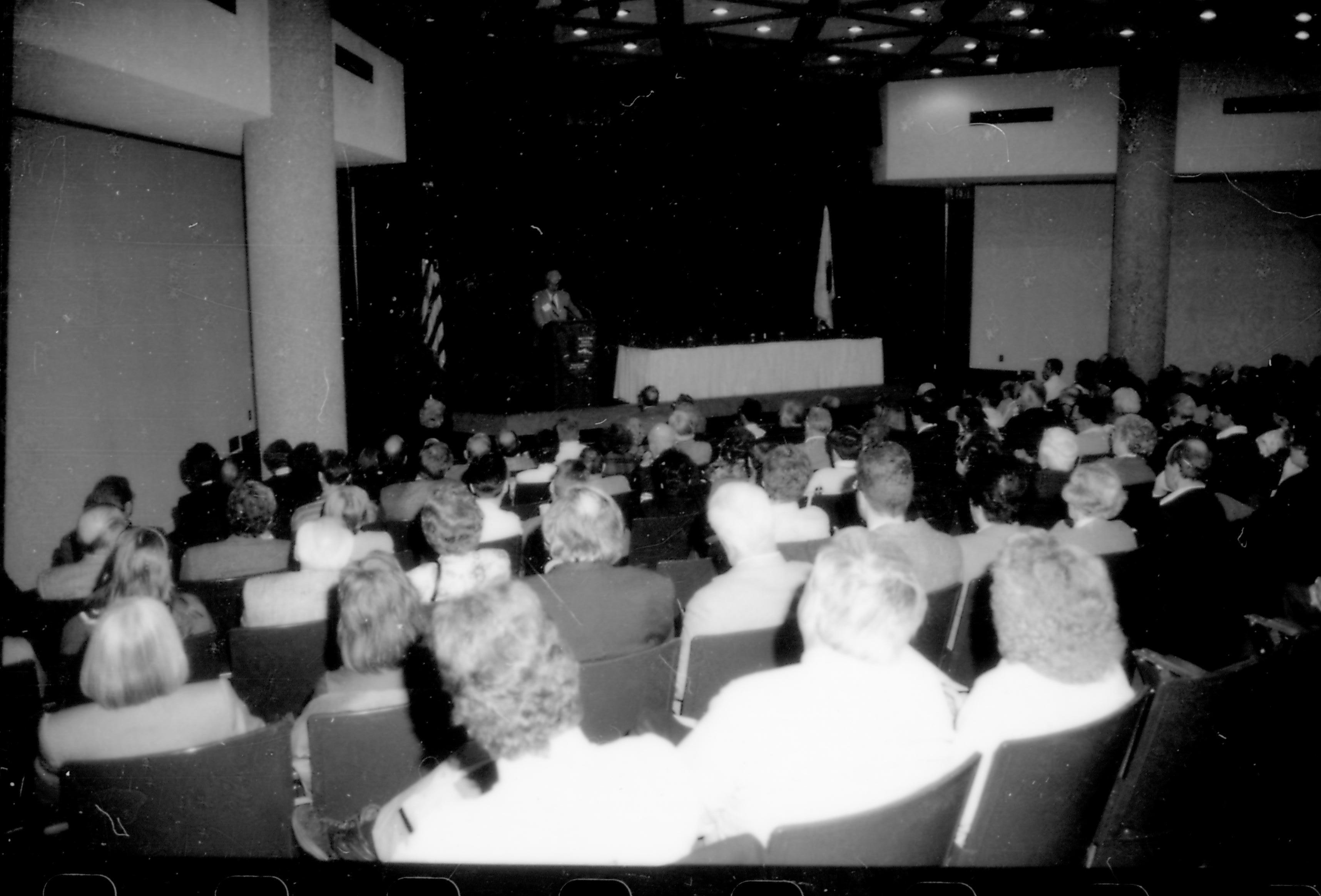 People, seated in lecture room, listening to speaker. 8th Annual Lincoln Colloquium; E Lincoln, Colloquium