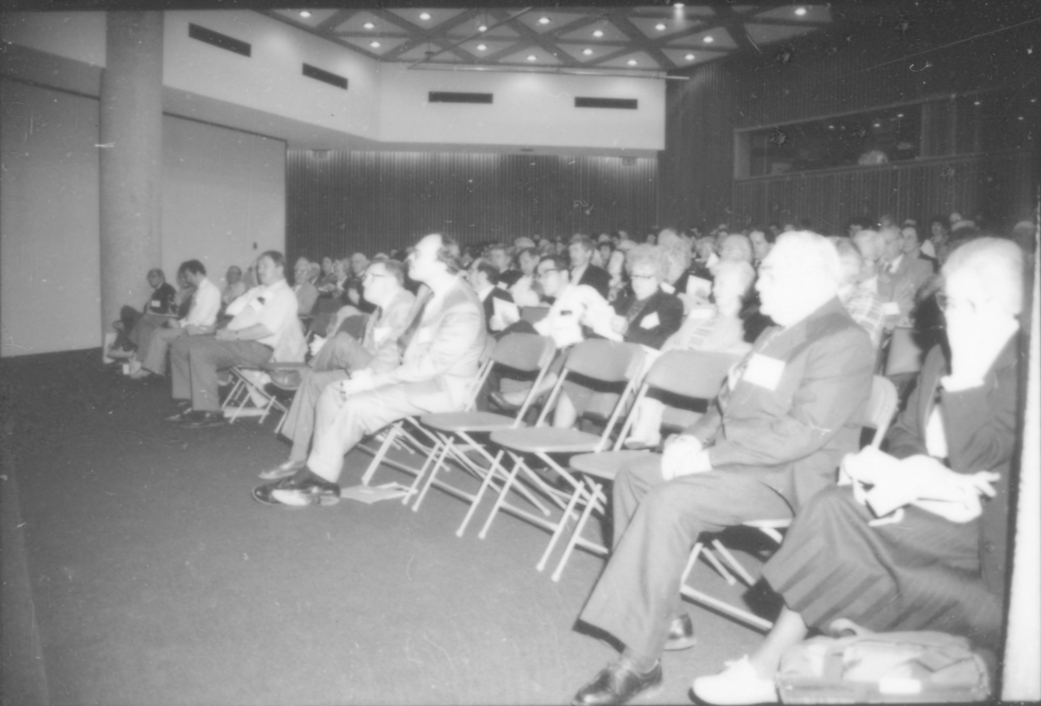 People, seated in lecture room, listening to speaker. 8th Annual Lincoln Colloquium; D Lincoln, Colloquium