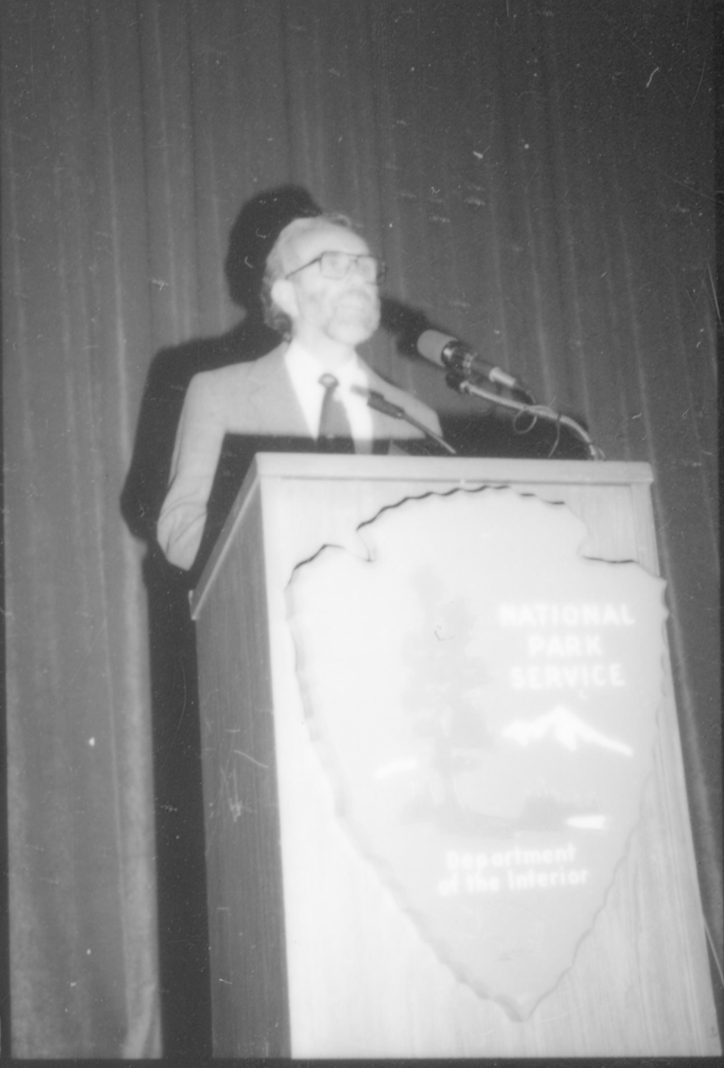 Close up of man speaking at podium. 8th Annual Lincoln Colloquium; D Lincoln, Colloquium