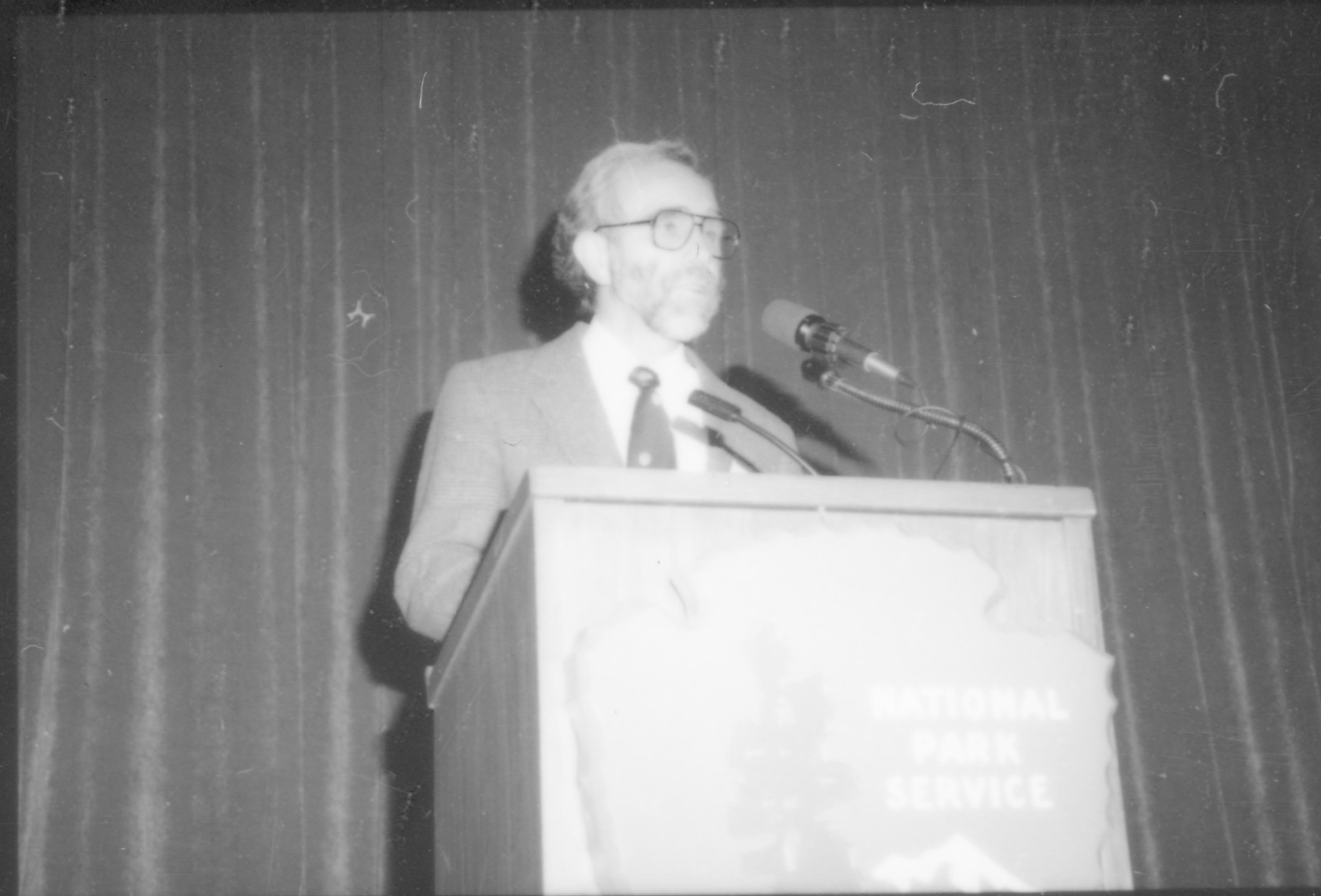 Close up of man speaking at podium. 8th Annual Lincoln Colloquium; D Lincoln, Colloquium