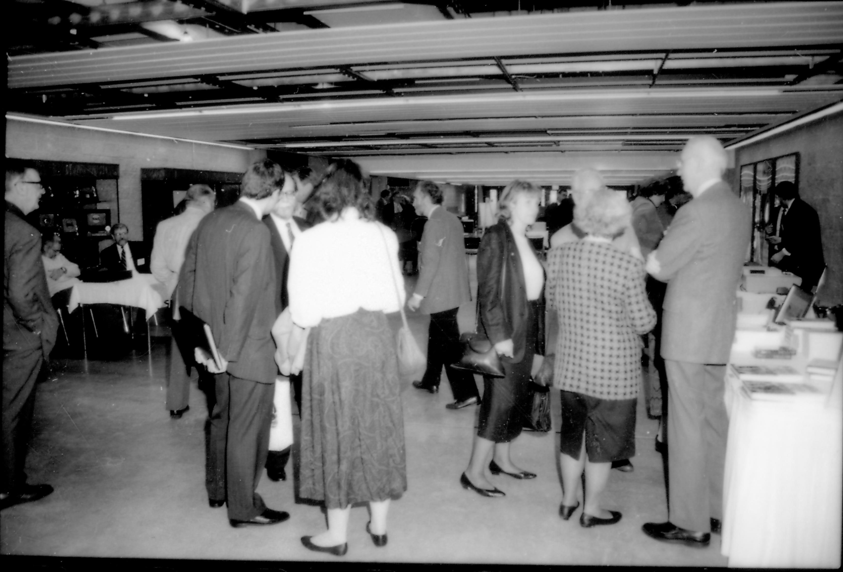 People standing sales area talking. 8th Annual Lincoln Colloquium; A Lincoln, Colloquium