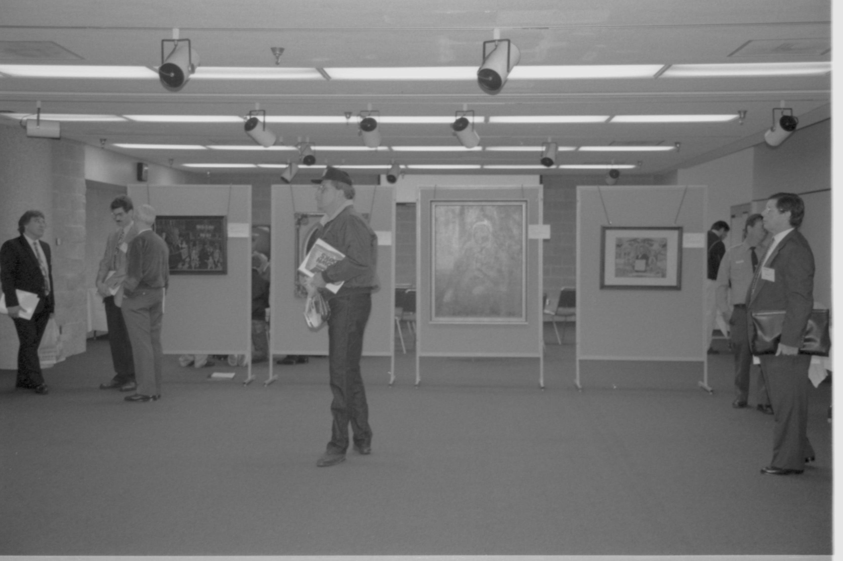 Attendees in large room with art work. Lincoln Colloquium; 88257 Lincoln, Colloquium