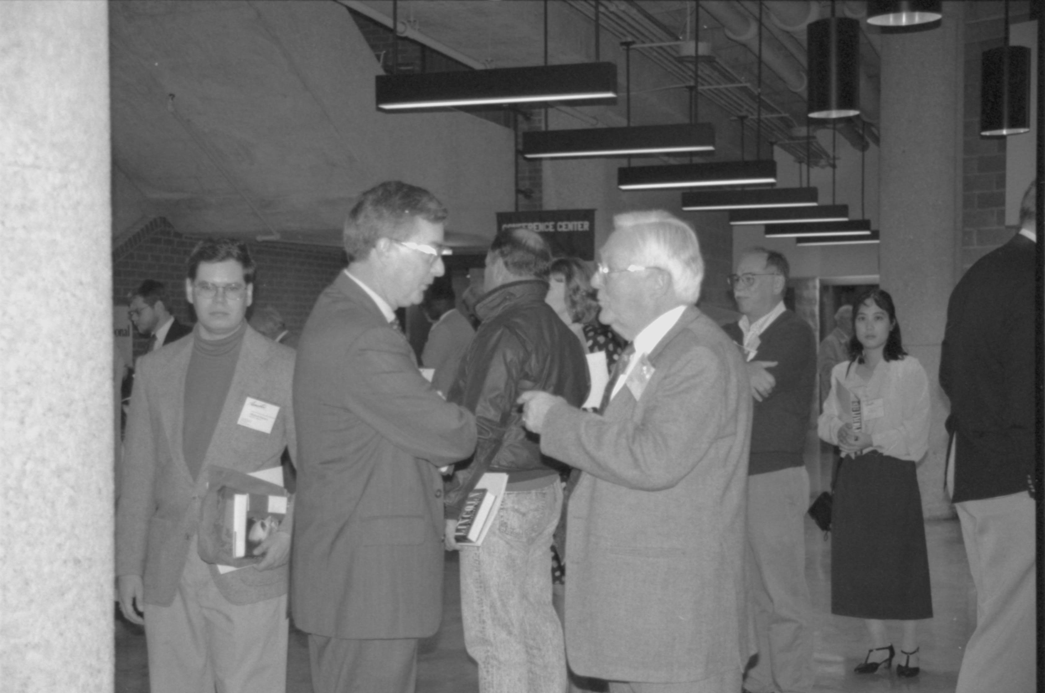 Two men conversing. Lincoln Colloquium; 88257 Lincoln, Colloquium