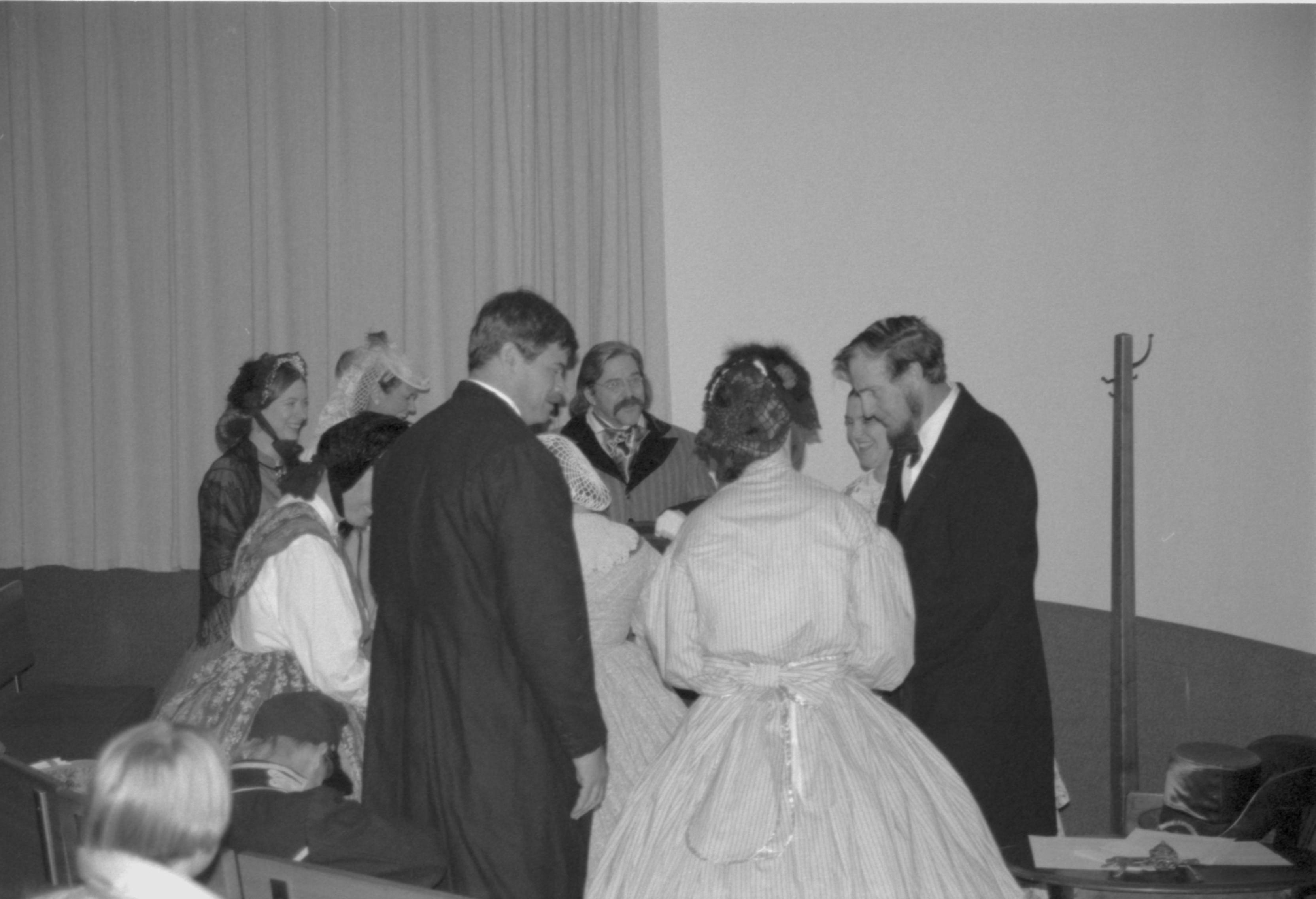 Group of people in period dress standing. Lincoln Colloquium; 88257 Lincoln, Colloquium