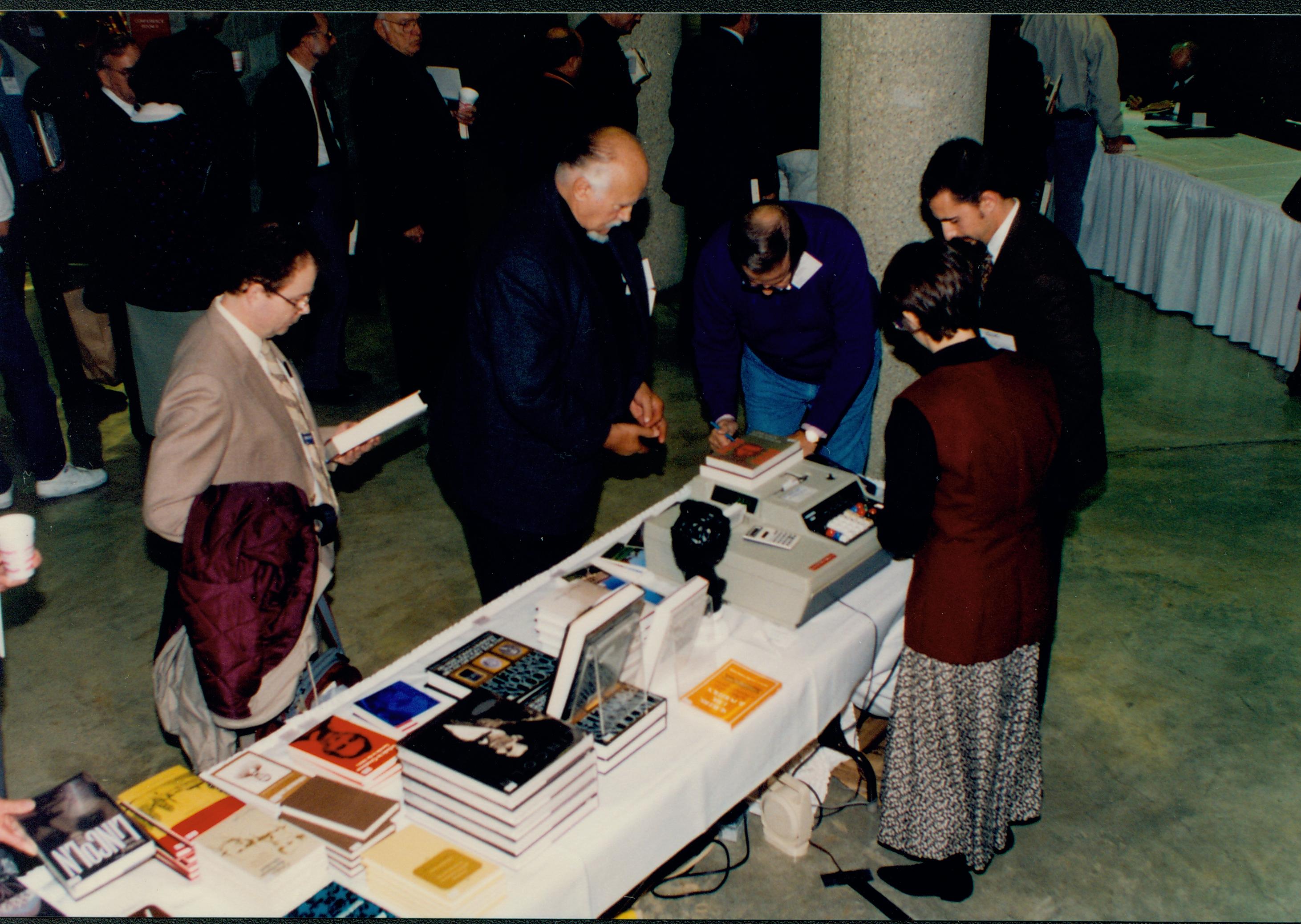 Looking down at book table and attendees. Lincoln Colloquium; 56918 Lincoln, Colloquium