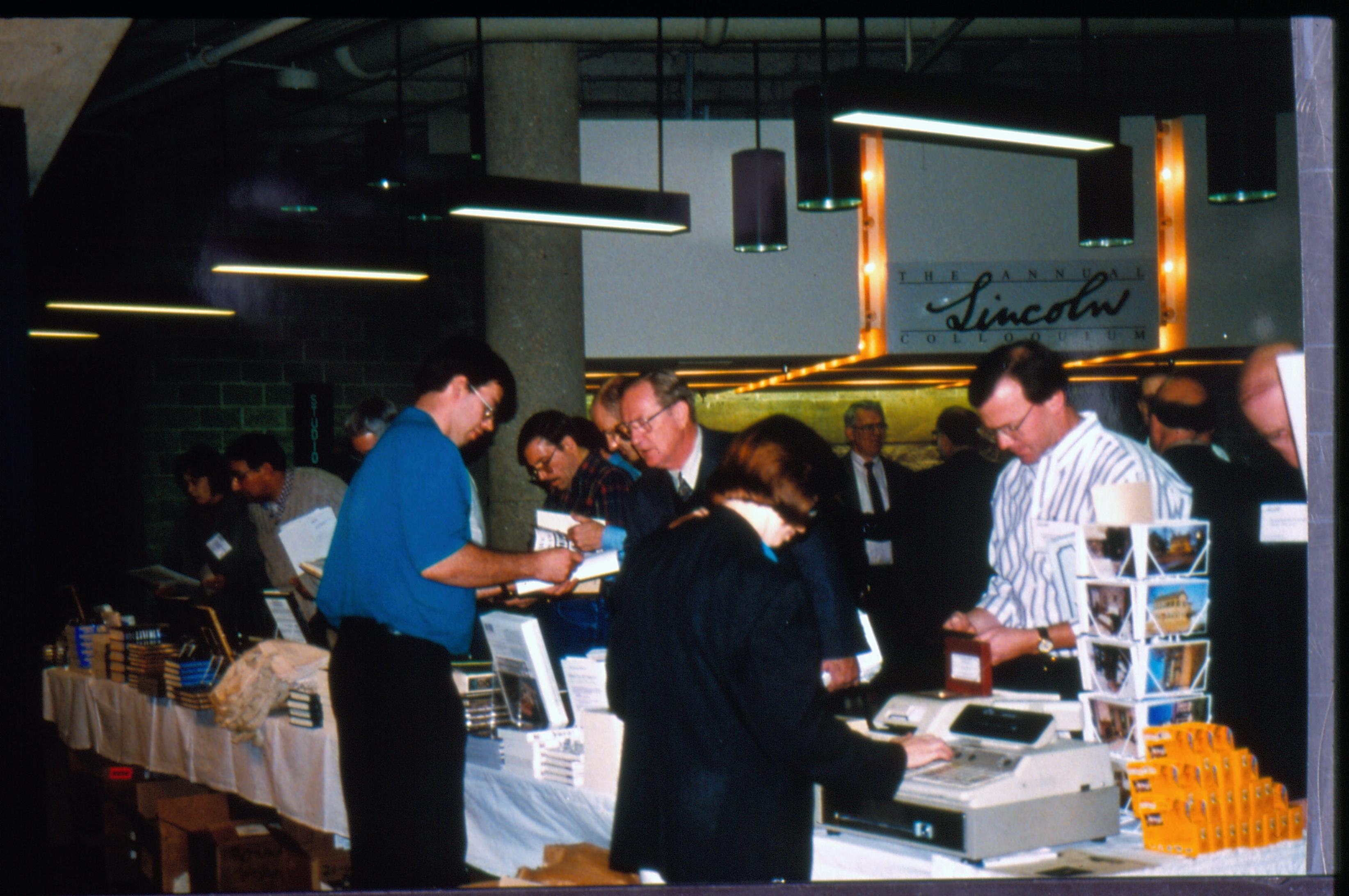 Visitors purchasing books. Lincoln Colloquium Lincoln, Colloquium