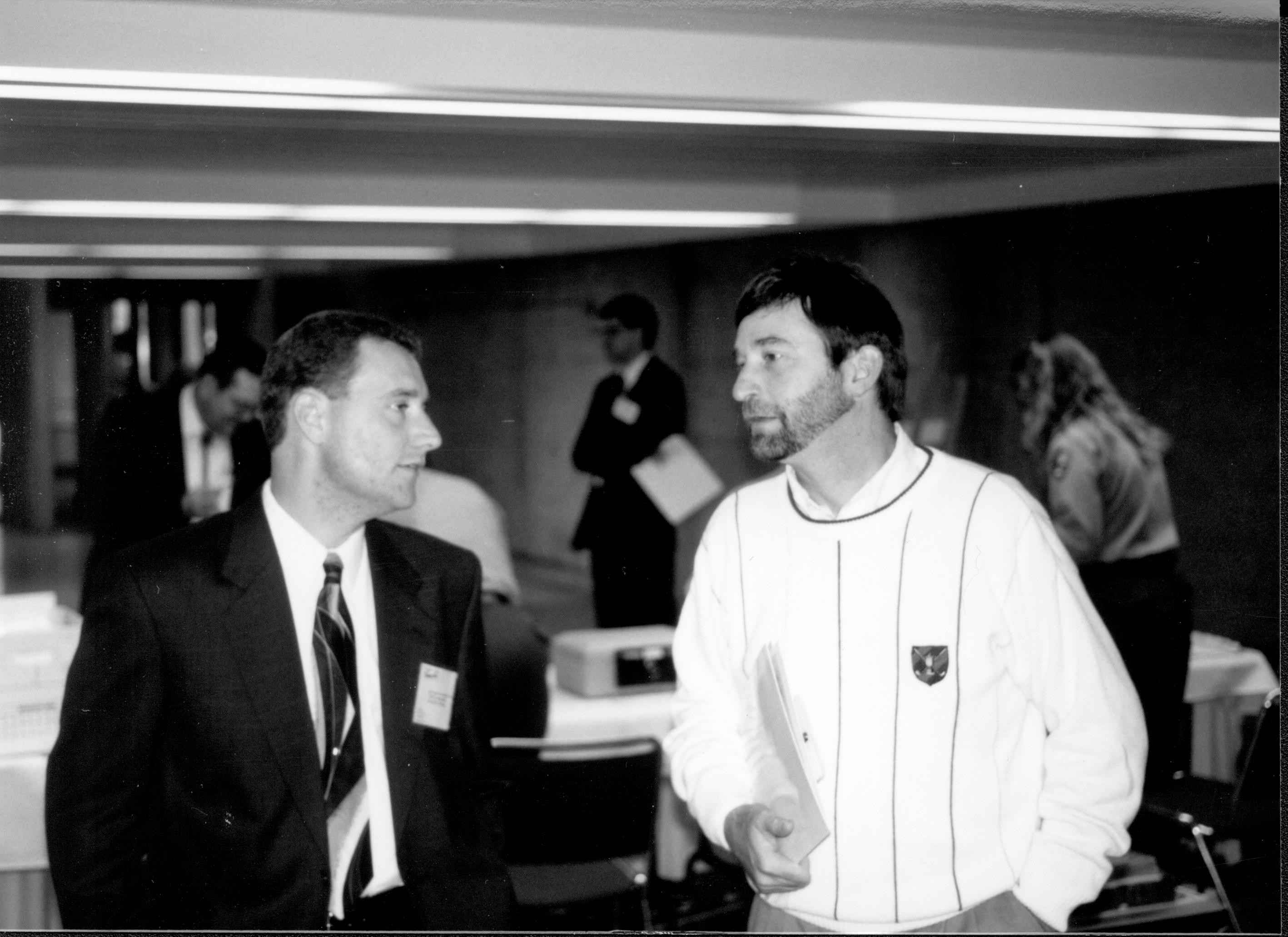 Two men talking. Lincoln Colloquium; UIS Roll#1, 3of4 Lincoln, Colloquium