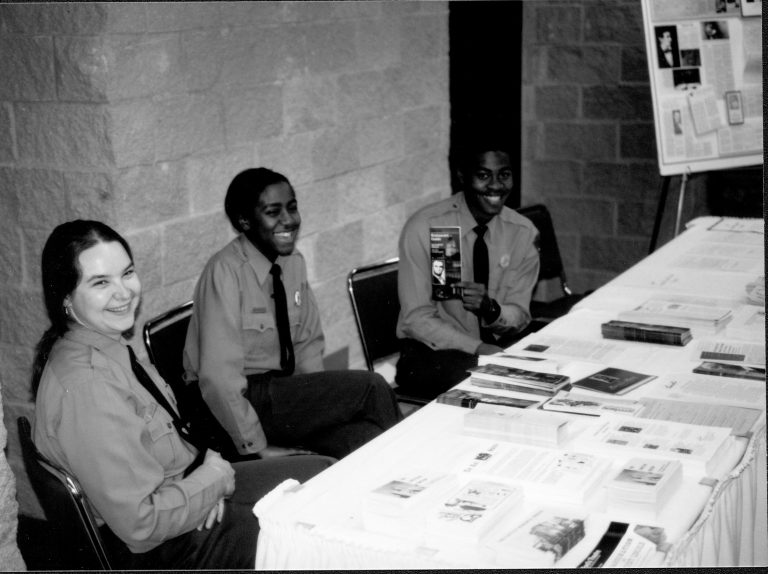 Park Rangers sitting behind table. Lincoln Colloquium; UIS Roll#1, 1of4 Lincoln, Colloquium