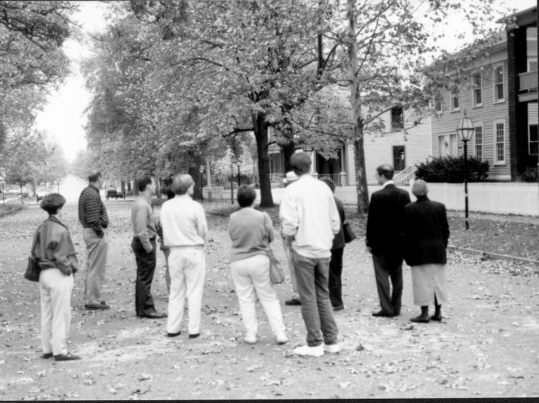 Visitors standing in street with Ranger. Lincoln Colloquium; UIS Roll#1, 1of4 Lincoln, Colloquium