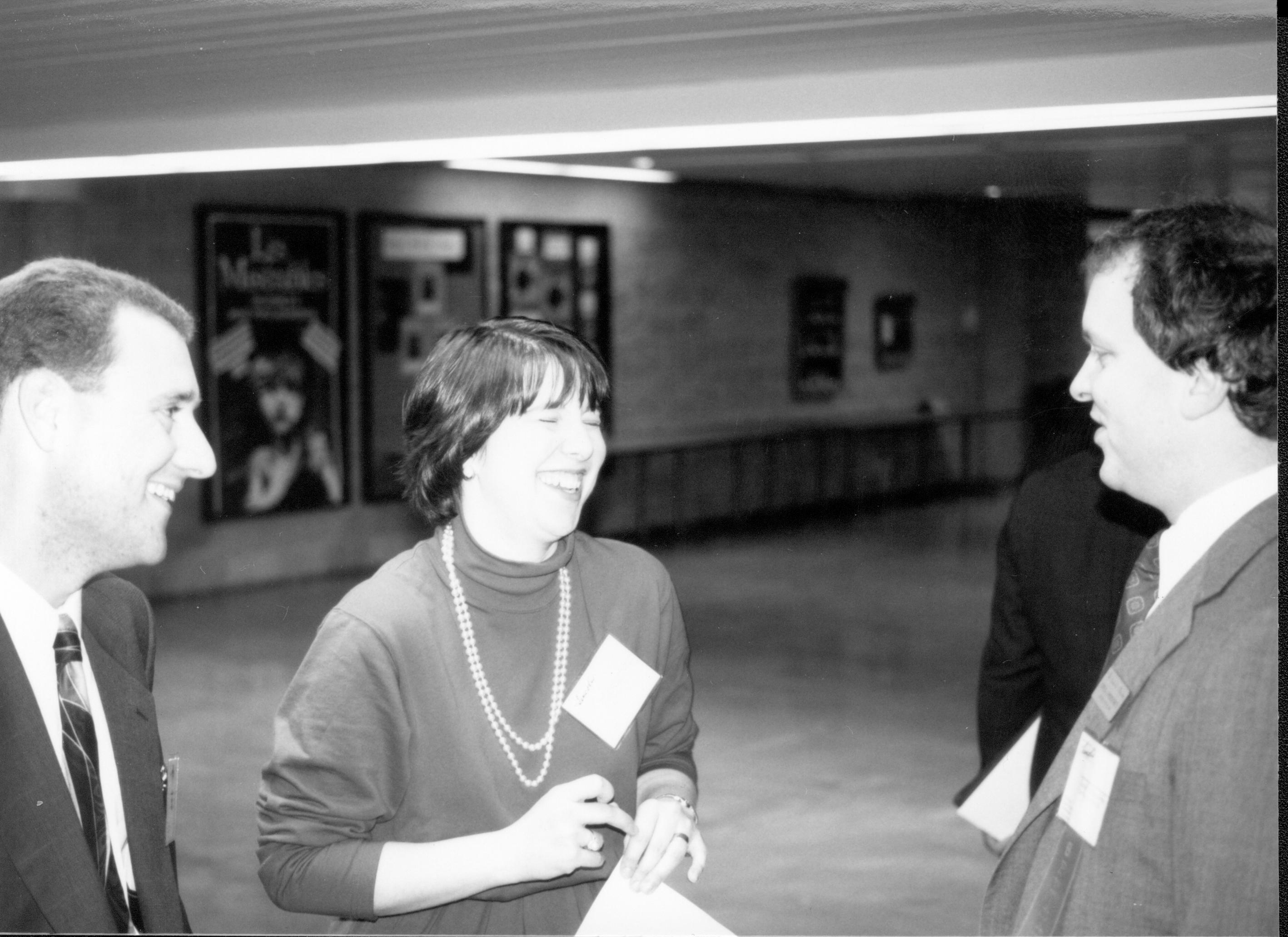 Woman and two men talking. Lincoln Colloquium; UIS Roll#2, 2of4 Lincoln, Colloquium